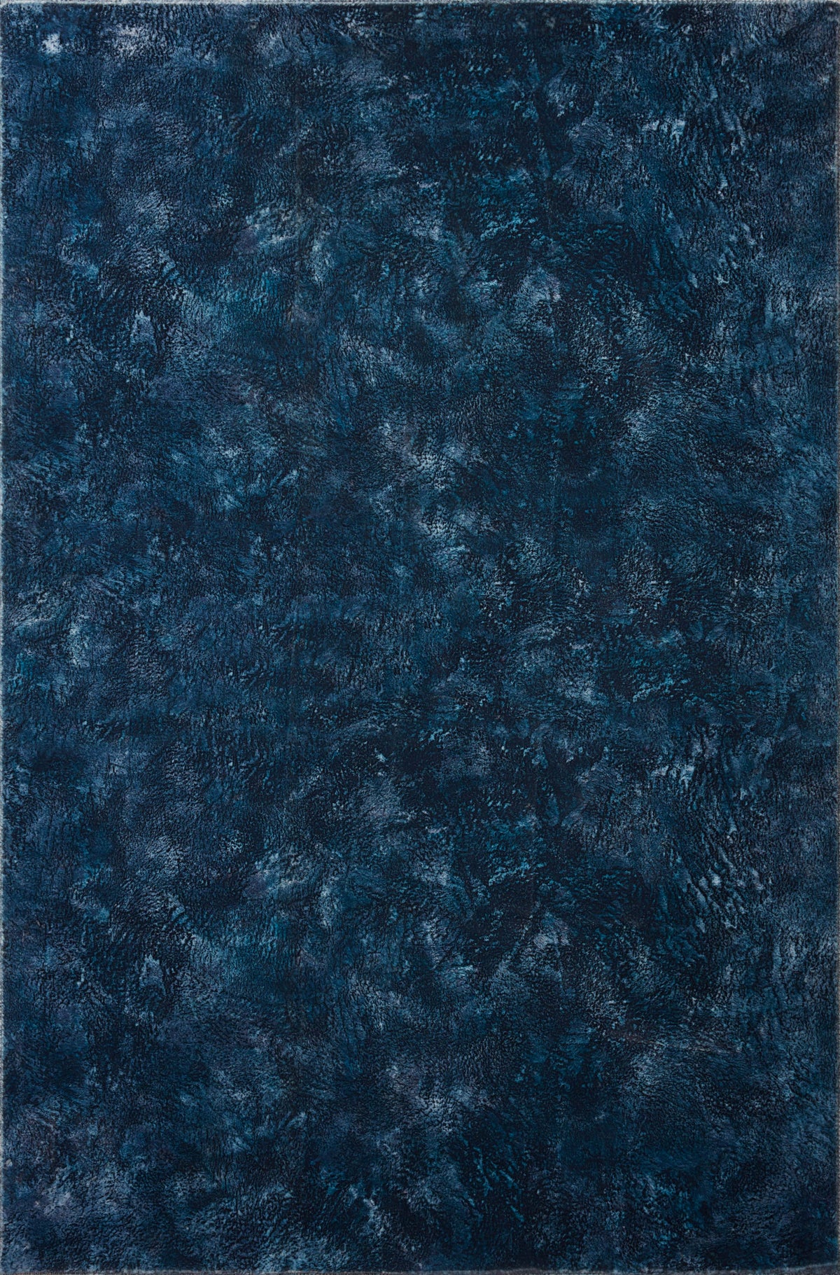 Contemporary power-loomed rug with mottled abstract design in midnight blue tones