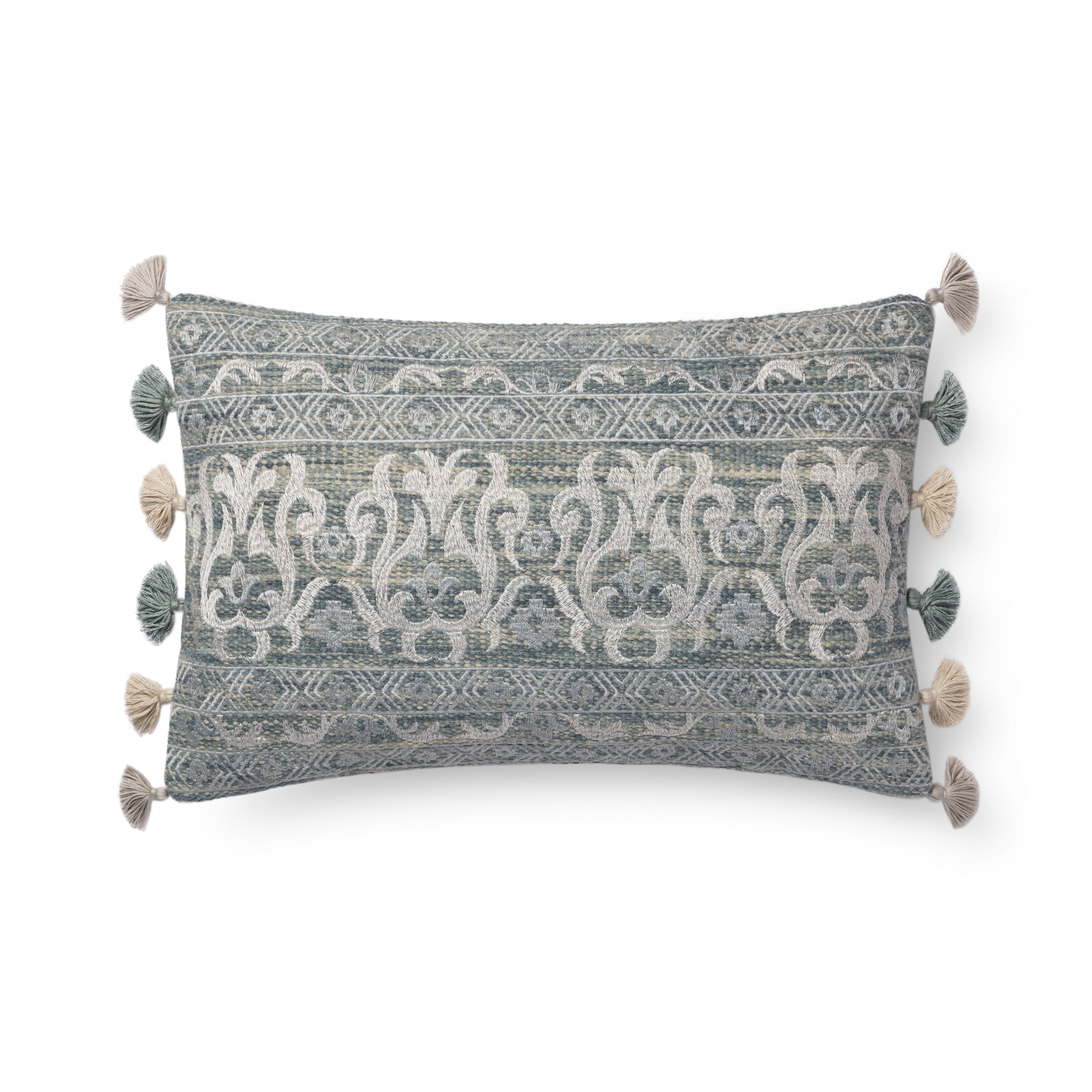 Loloi decorative throw pillow in aqua and silver with geometric pattern, tassel trim