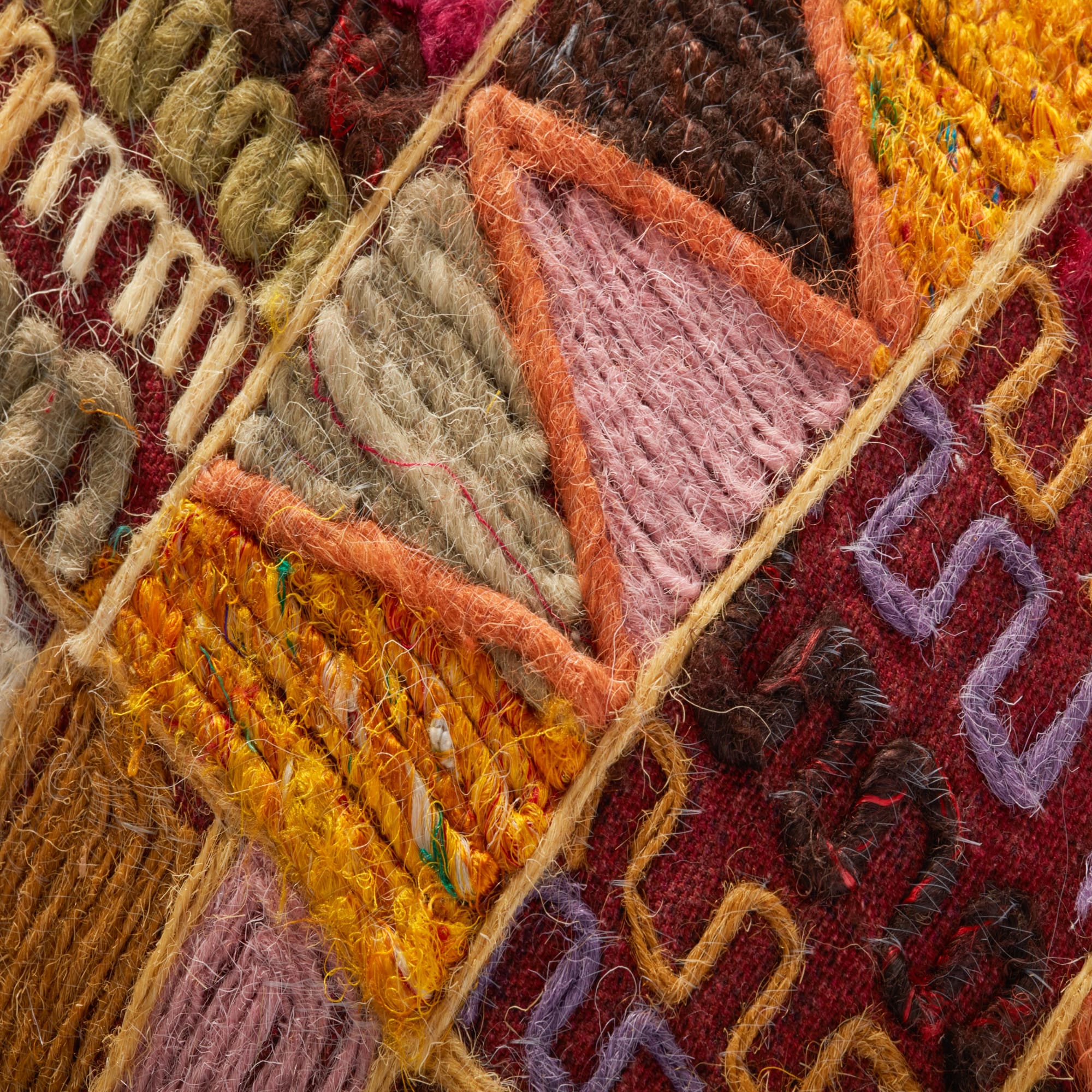 Multicolor woven pillow cover detail with textured yarn pattern