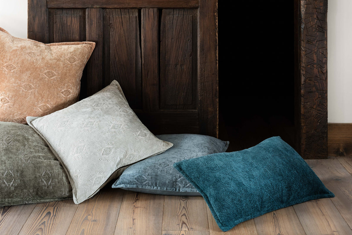 Teal down-filled decorative pillow with textured fabric, rectangular shape