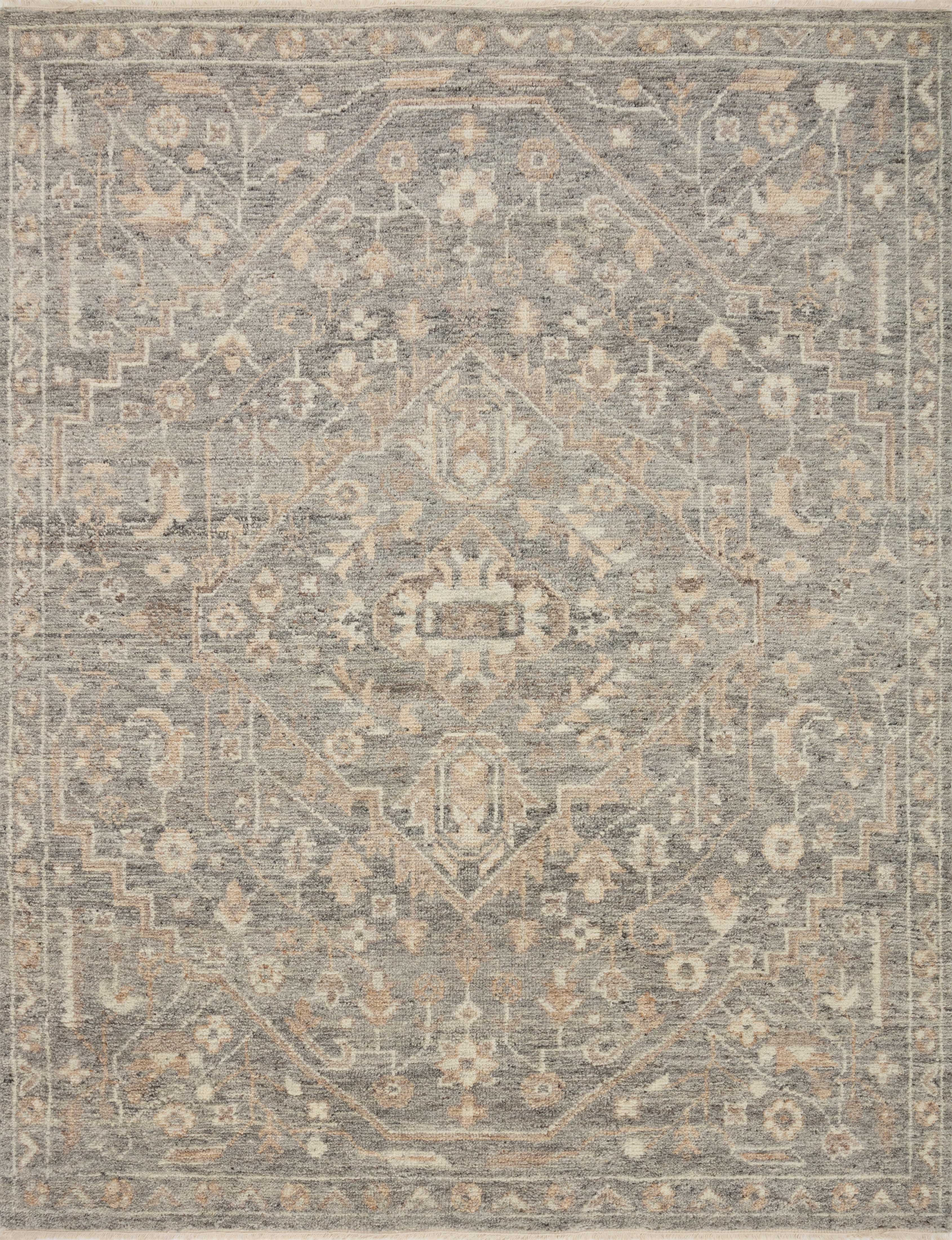 Traditional wool rug with ornate geometric medallion pattern in light gray and beige tones