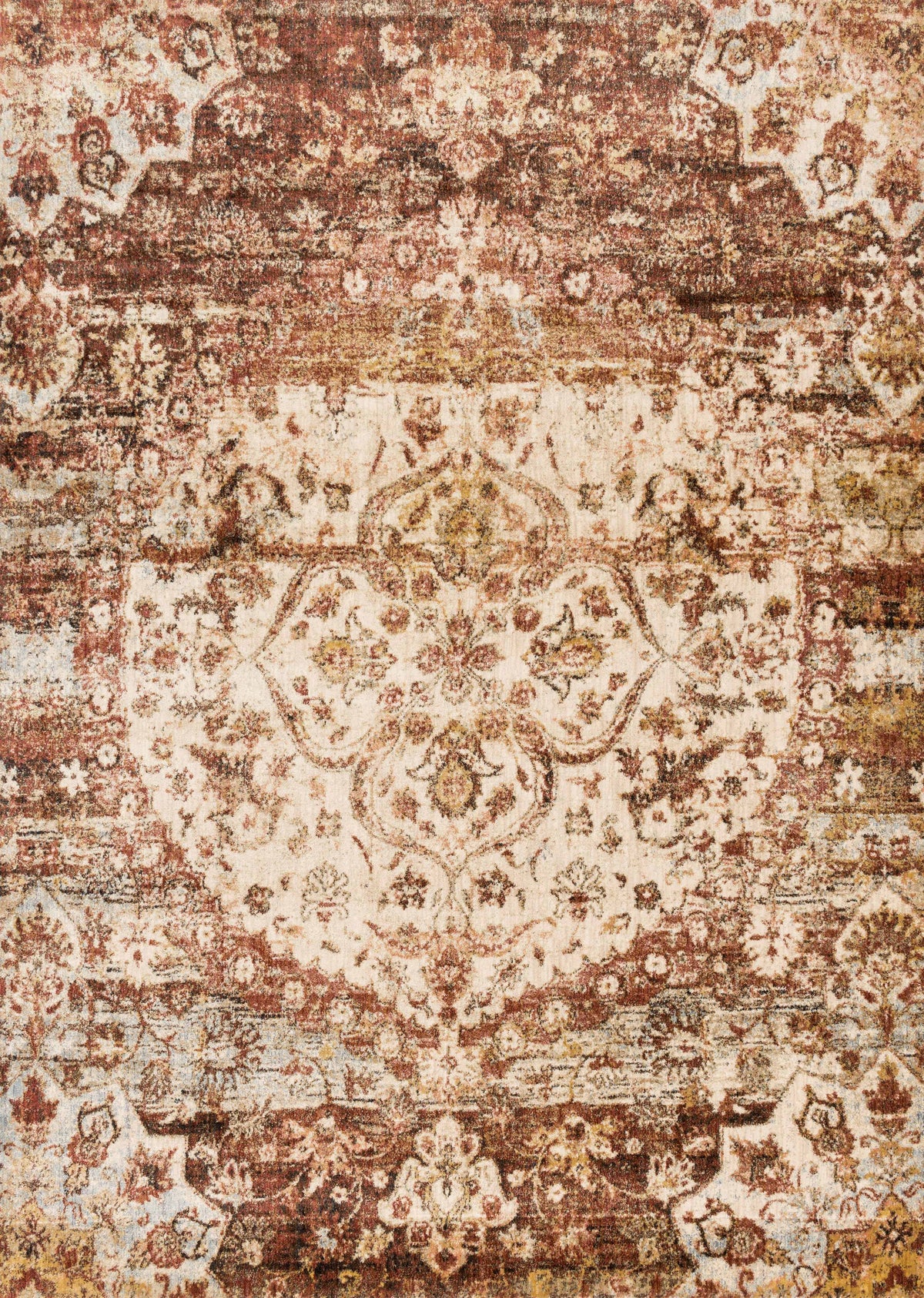 Rust and ivory patterned rug with ornate distressed motifs