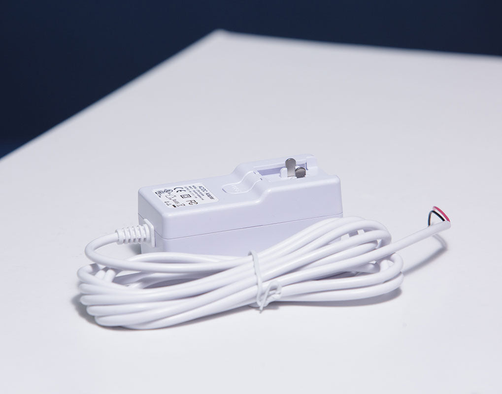 DoorBird 15V mains adaptor with long cable and DC output connector, close-up