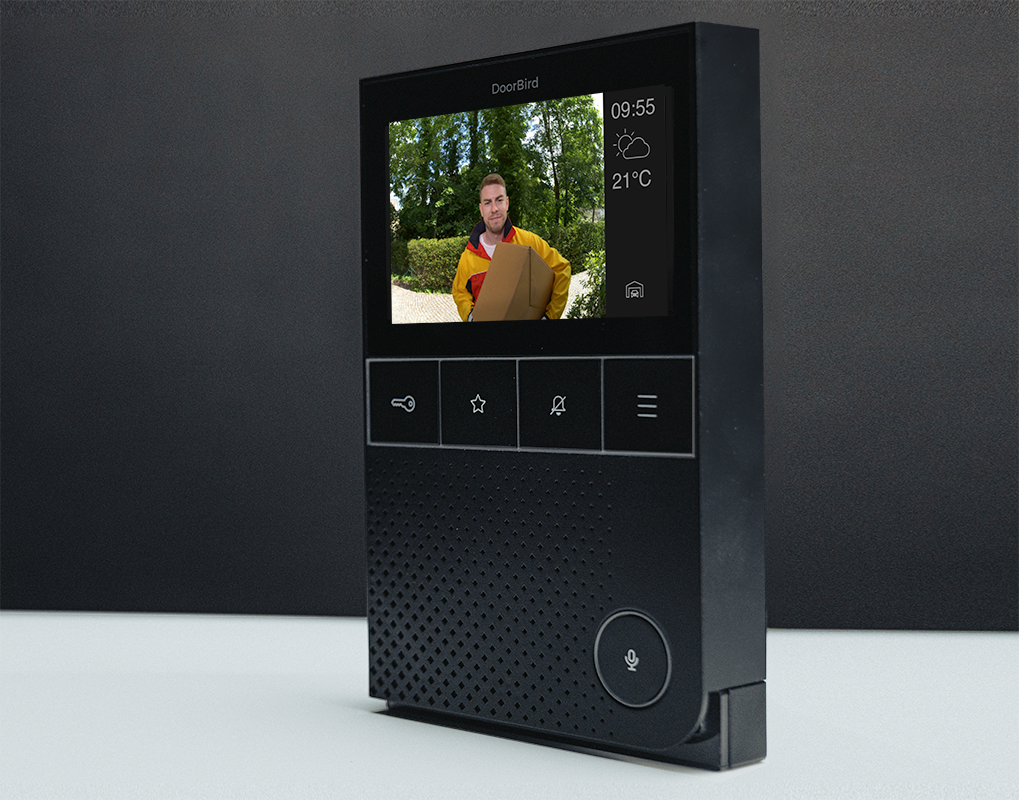 Black indoor video door station showing live visitor feed and time