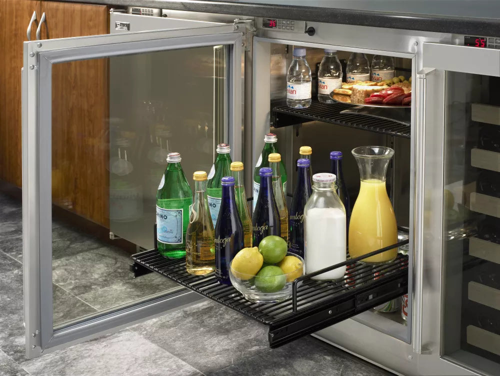 Stainless compact refrigerator with open glass door; interior shelves with bottles