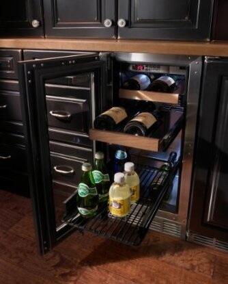 Perlick beverage center with open door, black shelves, and wine bottle rack