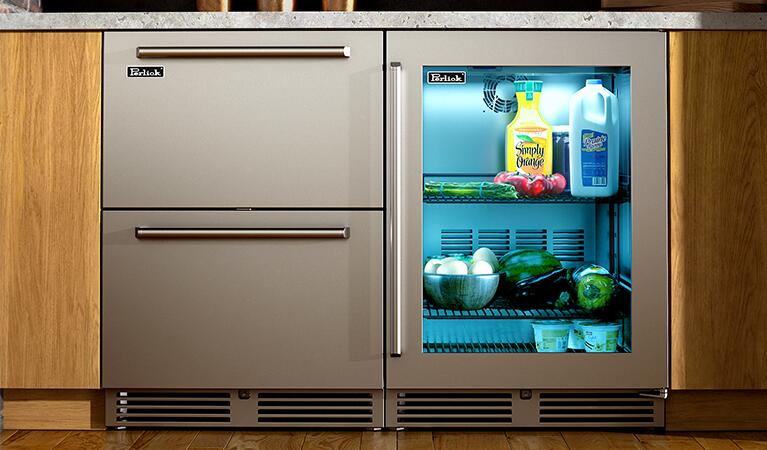 Perlick built-in stainless compact refrigerator with glass door, installed in cabinet