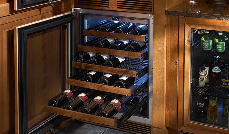 Wine cooler with glass door showing rows of bottles on slide-out racks