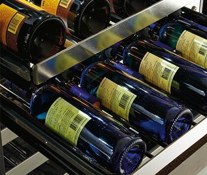 Single-zone wine cooler interior with rows of blue wine bottles on racks