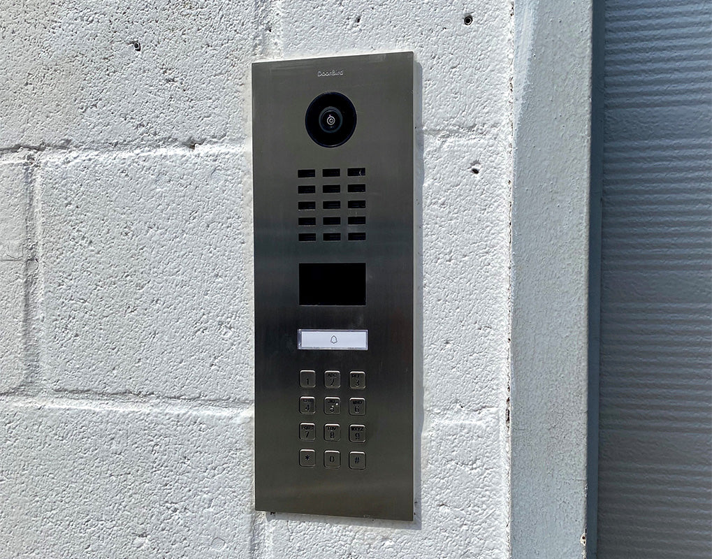 Stainless steel video intercom call panel with camera lens, speaker grille, and keypad