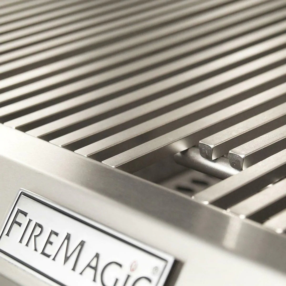 Stainless grill grates with Fire Magic brand badge on front panel