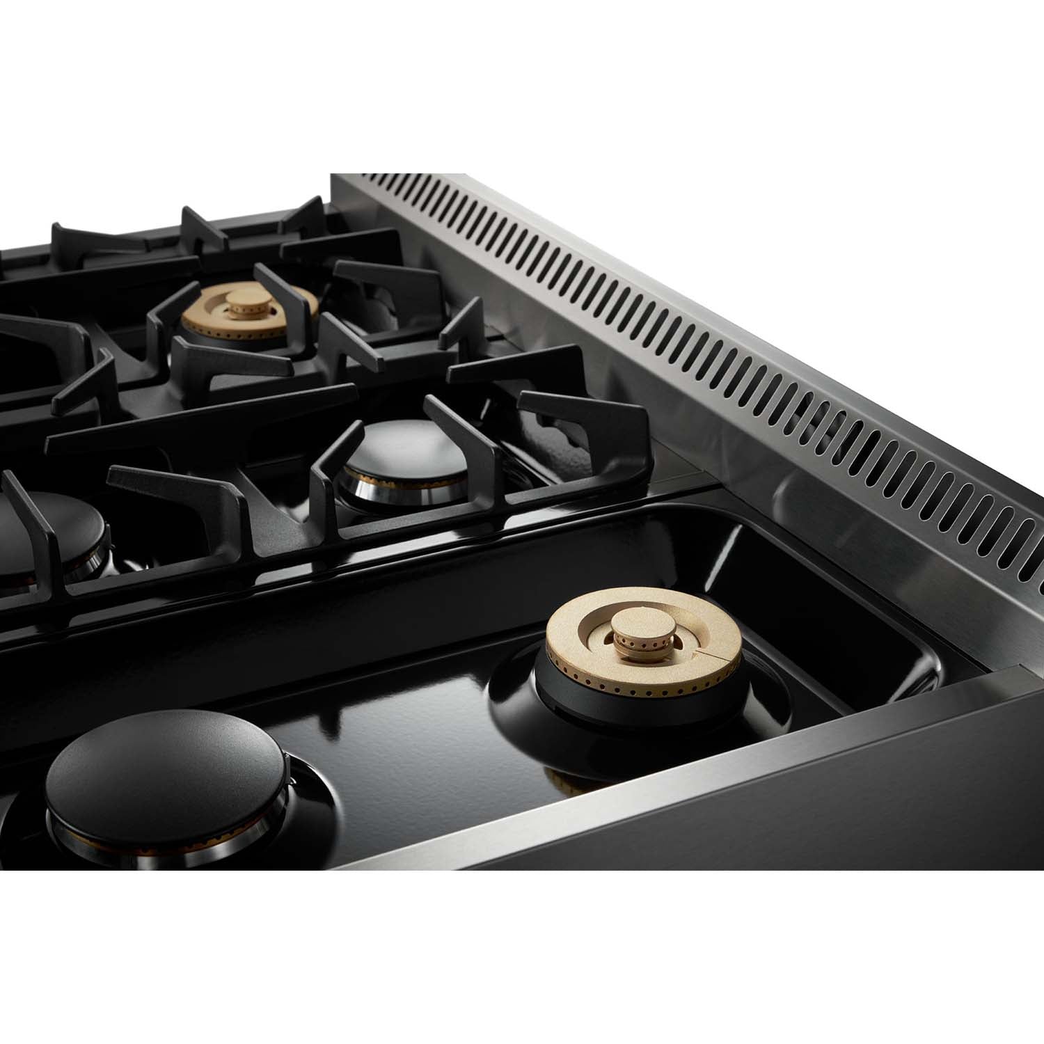 Stainless steel gas cooktop close-up with burner caps and black burner grates