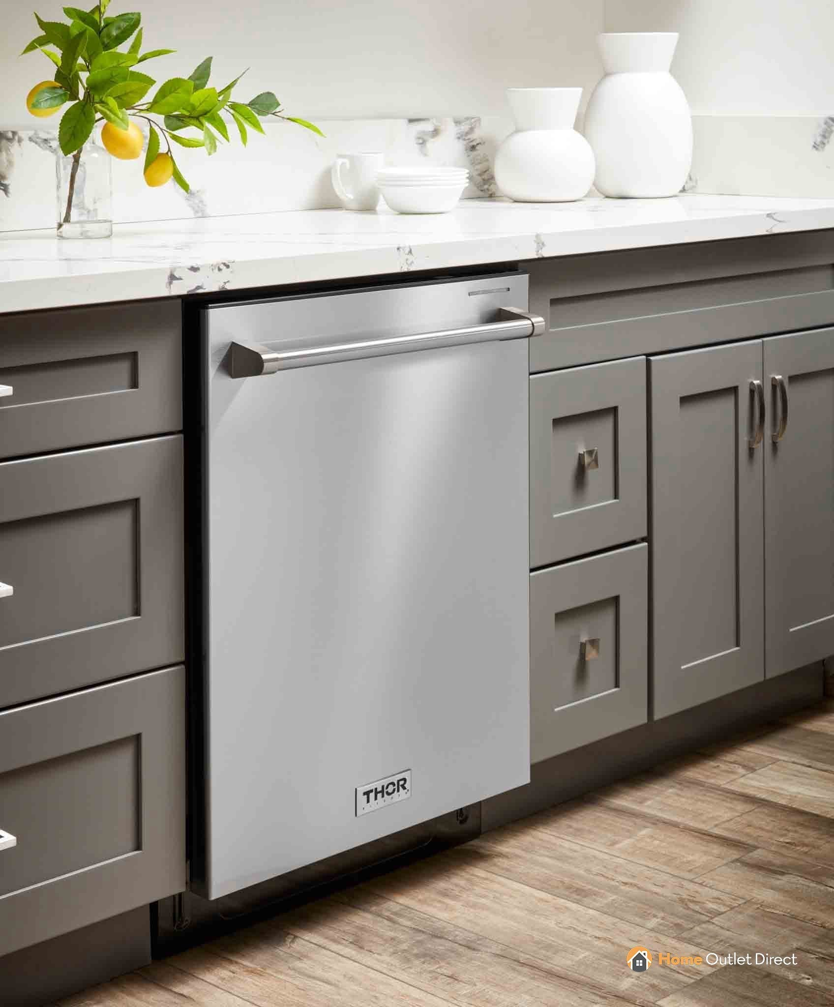 Stainless steel built-in dishwasher under countertop, framed by cabinet doors