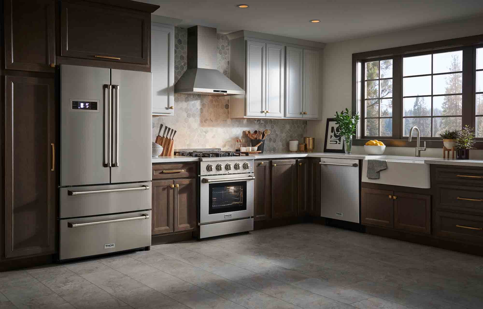 Stainless steel gas range in kitchen with front burners and oven door
