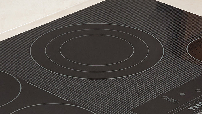 Thor electric cooktop surface with circular heating element outlines