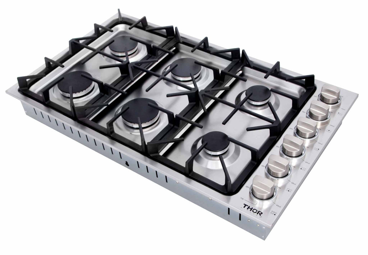 Stainless steel 6-burner gas cooktop with black grates and burner caps, knob controls