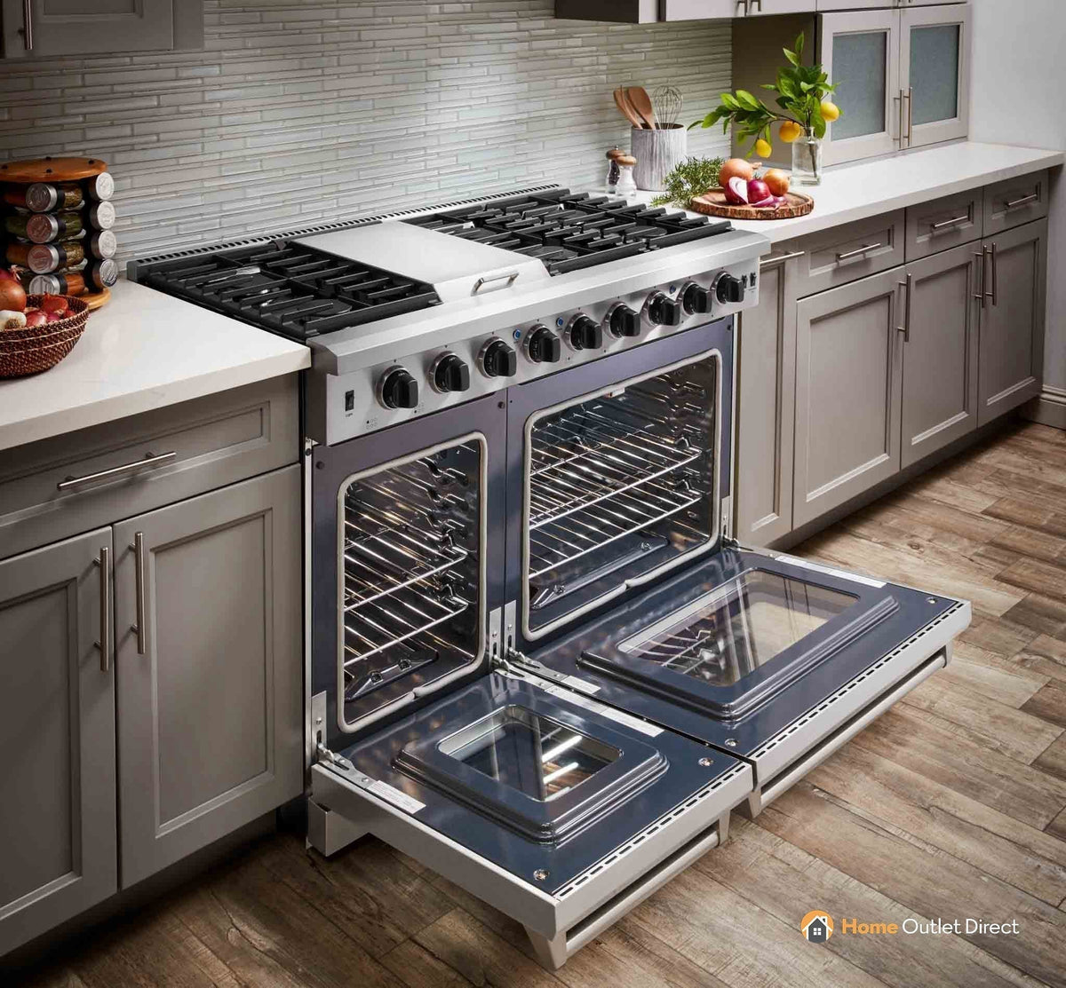 Stainless gas range with dual open ovens, front knobs, and grates