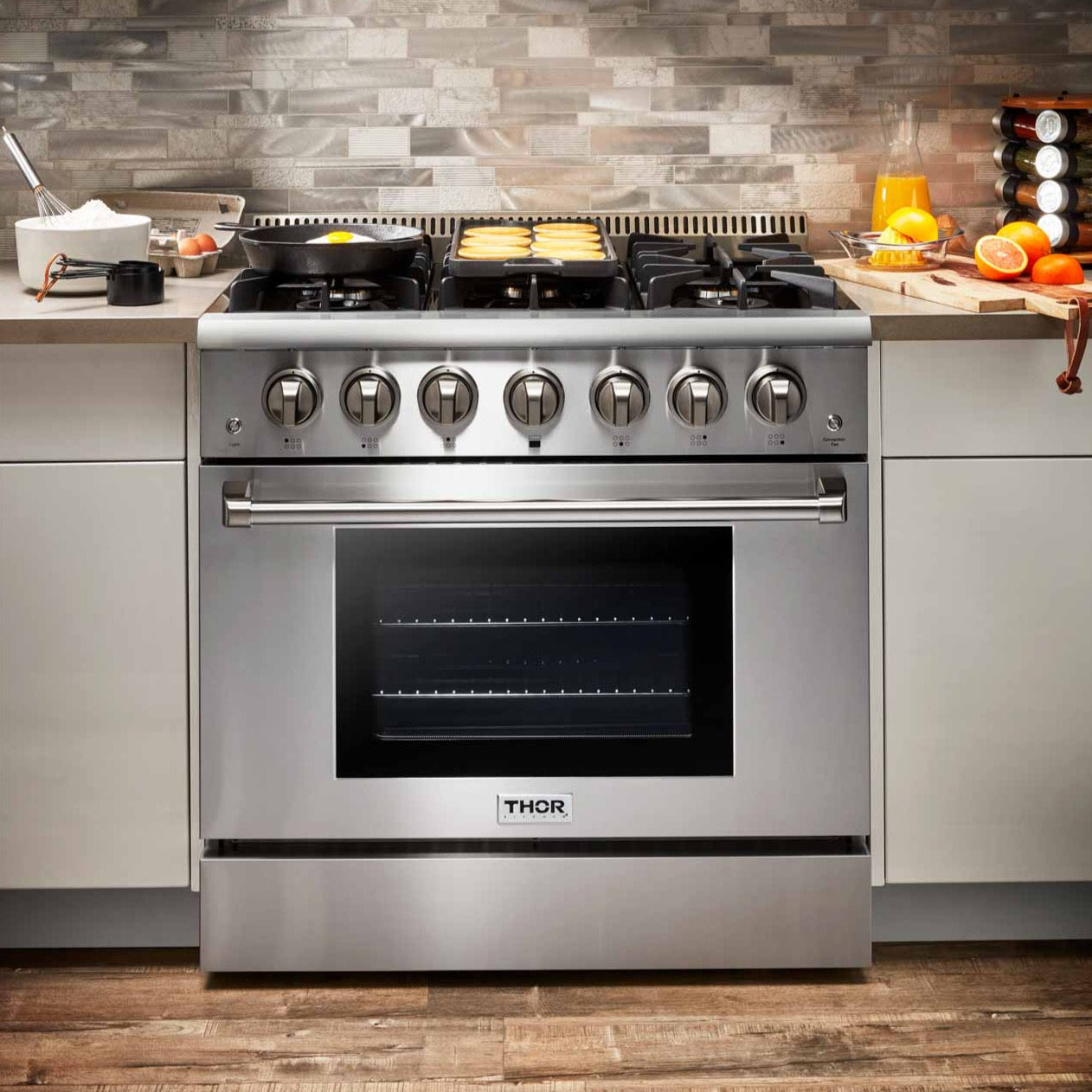 Stainless dual-fuel range with five burners and oven door window, front control knobs