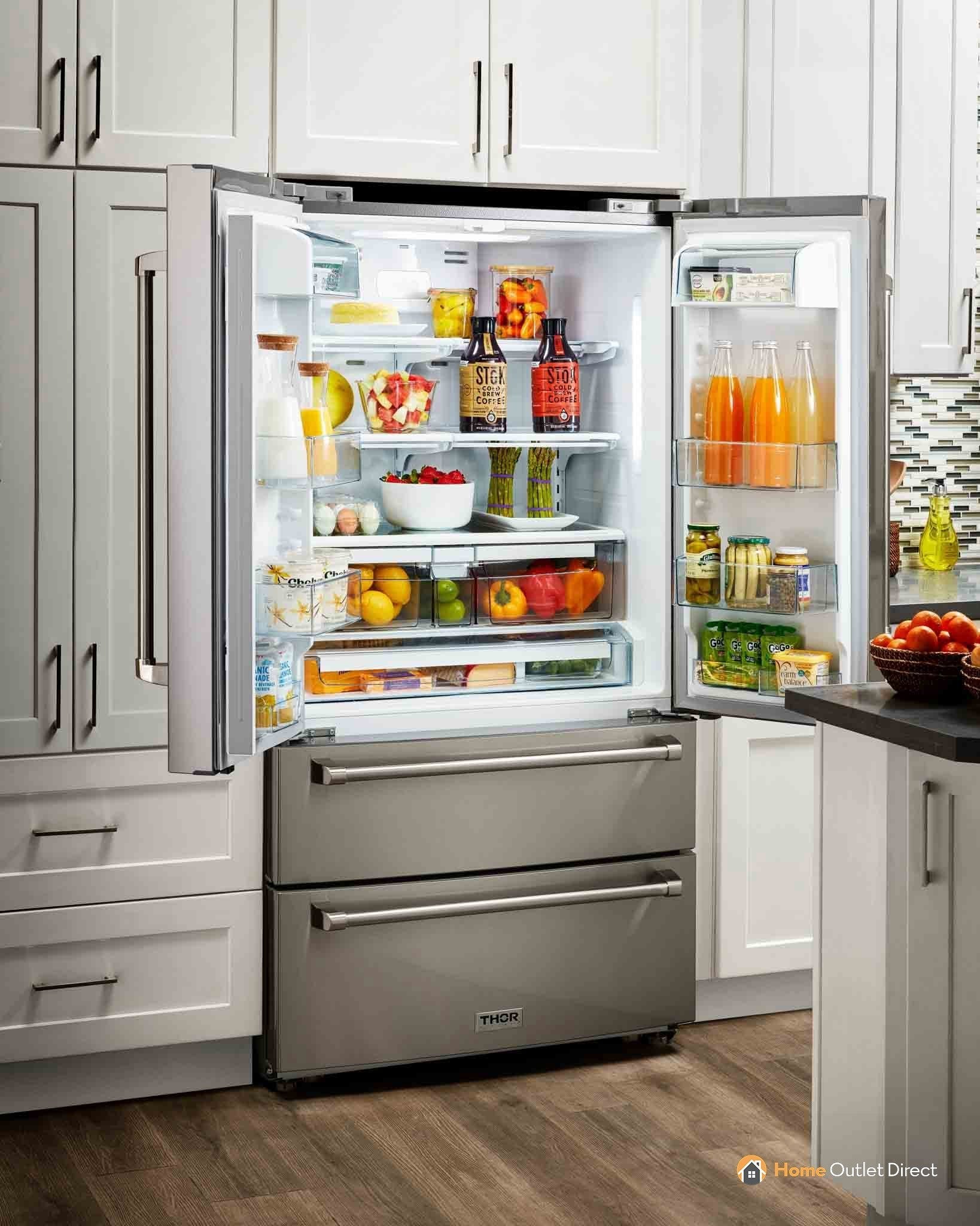 Stainless steel refrigerator with open door and interior storage shelves