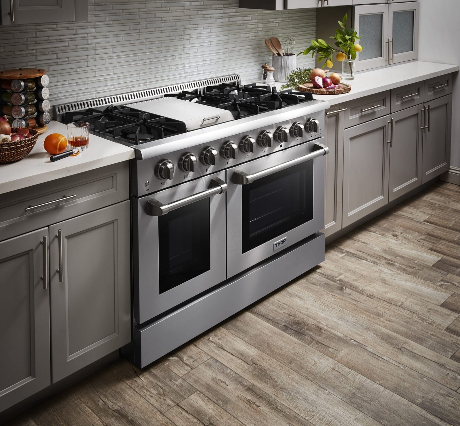 Stainless steel dual fuel range with six burners and dual oven doors, front view