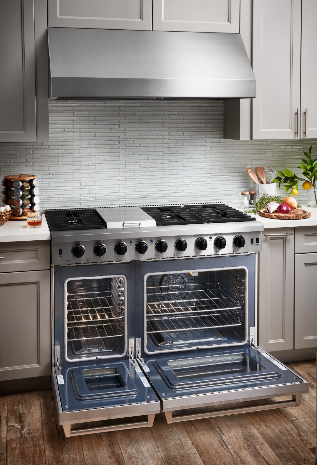 Thor gas range with both oven doors open and black interior racks