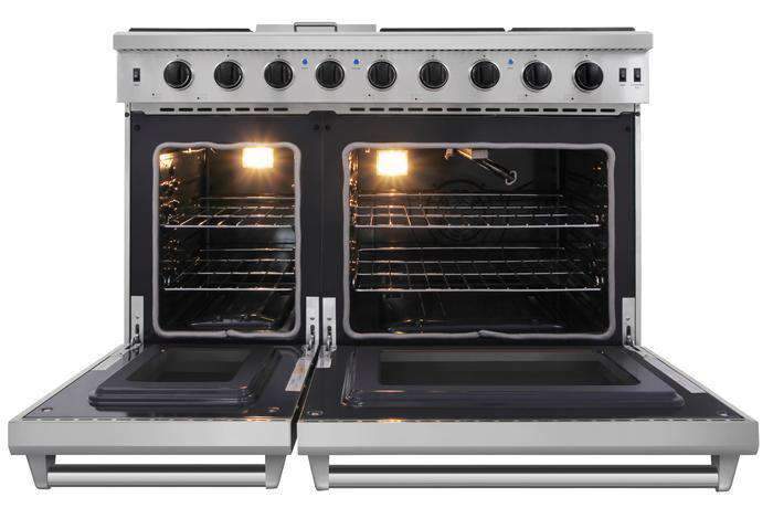 Stainless steel gas range with illuminated oven compartments and control knobs