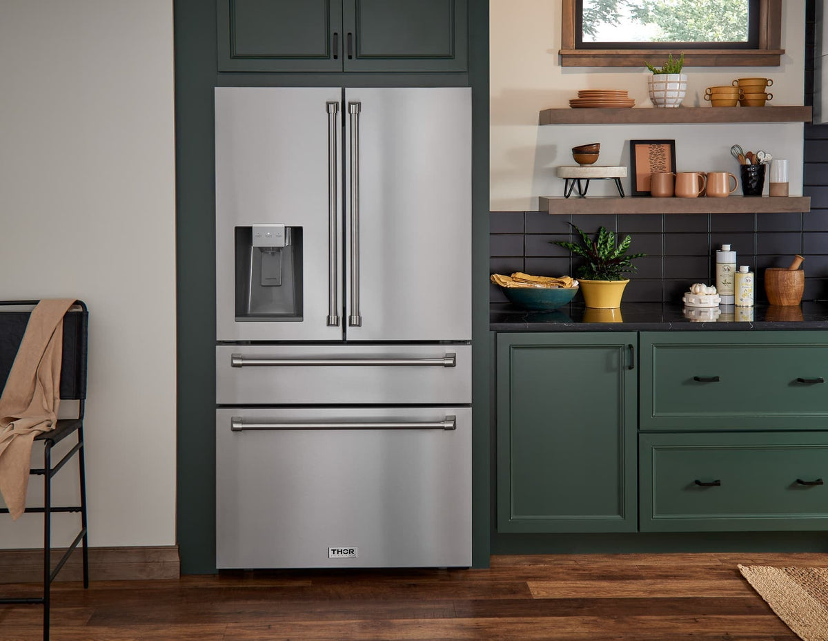 Stainless refrigerator and gas range with control panel and oven handle