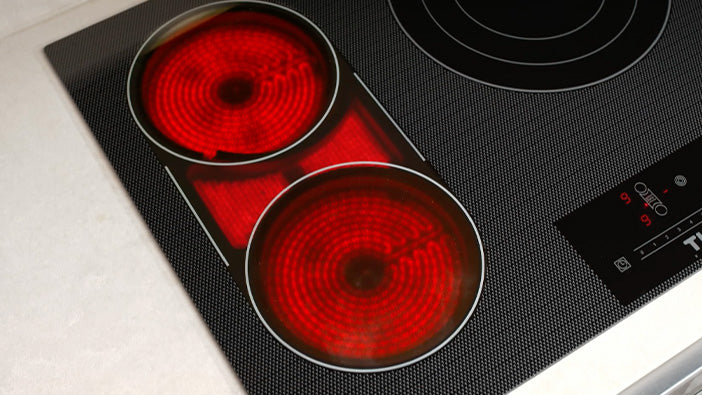 Thor electric cooktop with two glowing red radiant heating elements