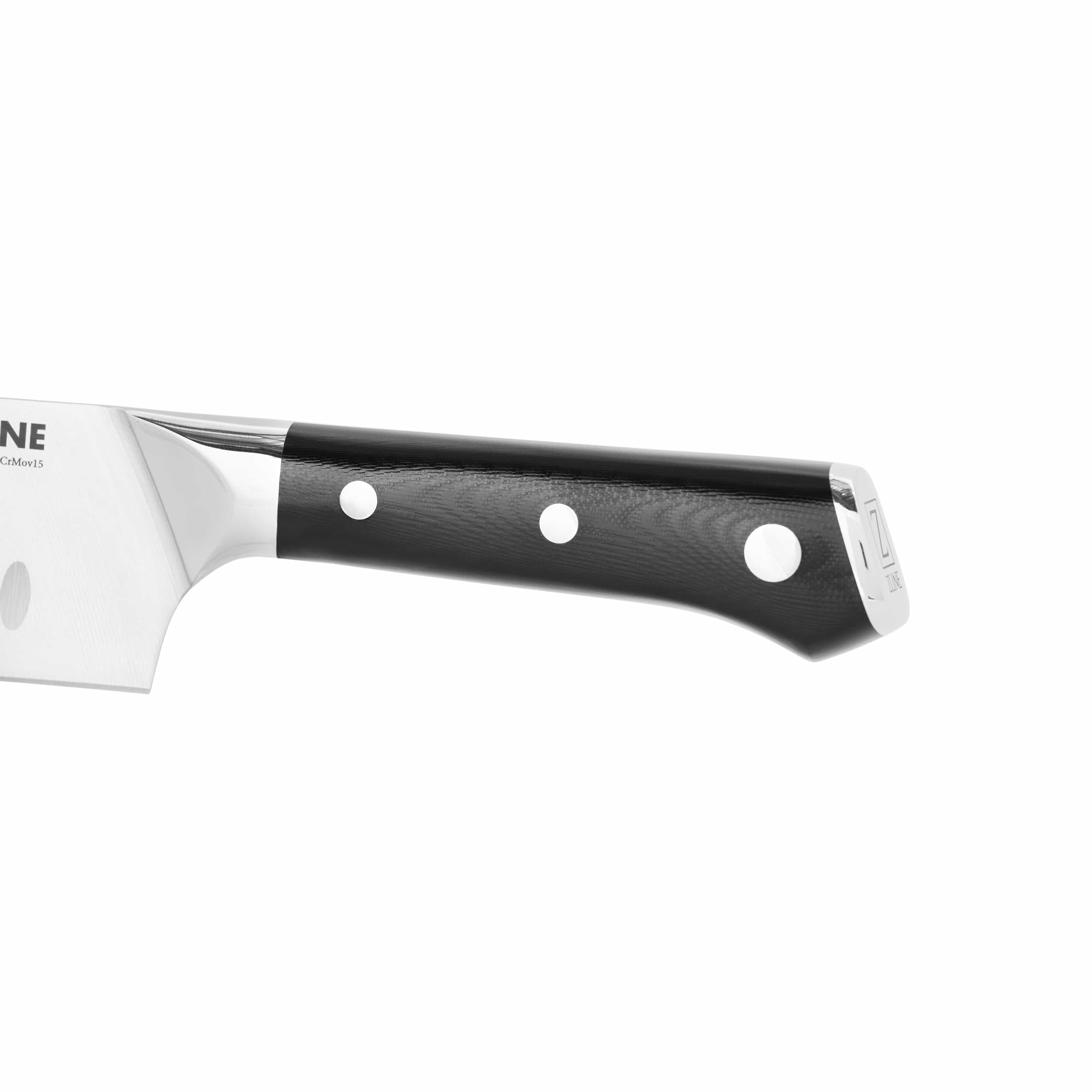 Chef’s knife handle detail with black textured grip and white dot rivets