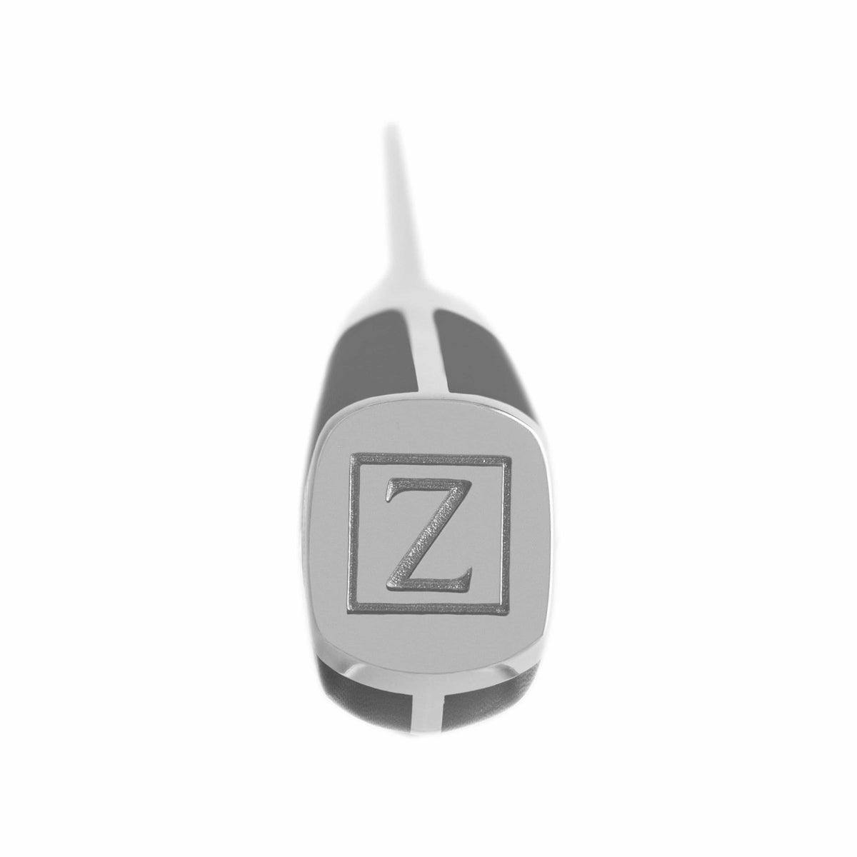 Kitchen knife handle end with ZLINE emblem on dark grip, stainless blade