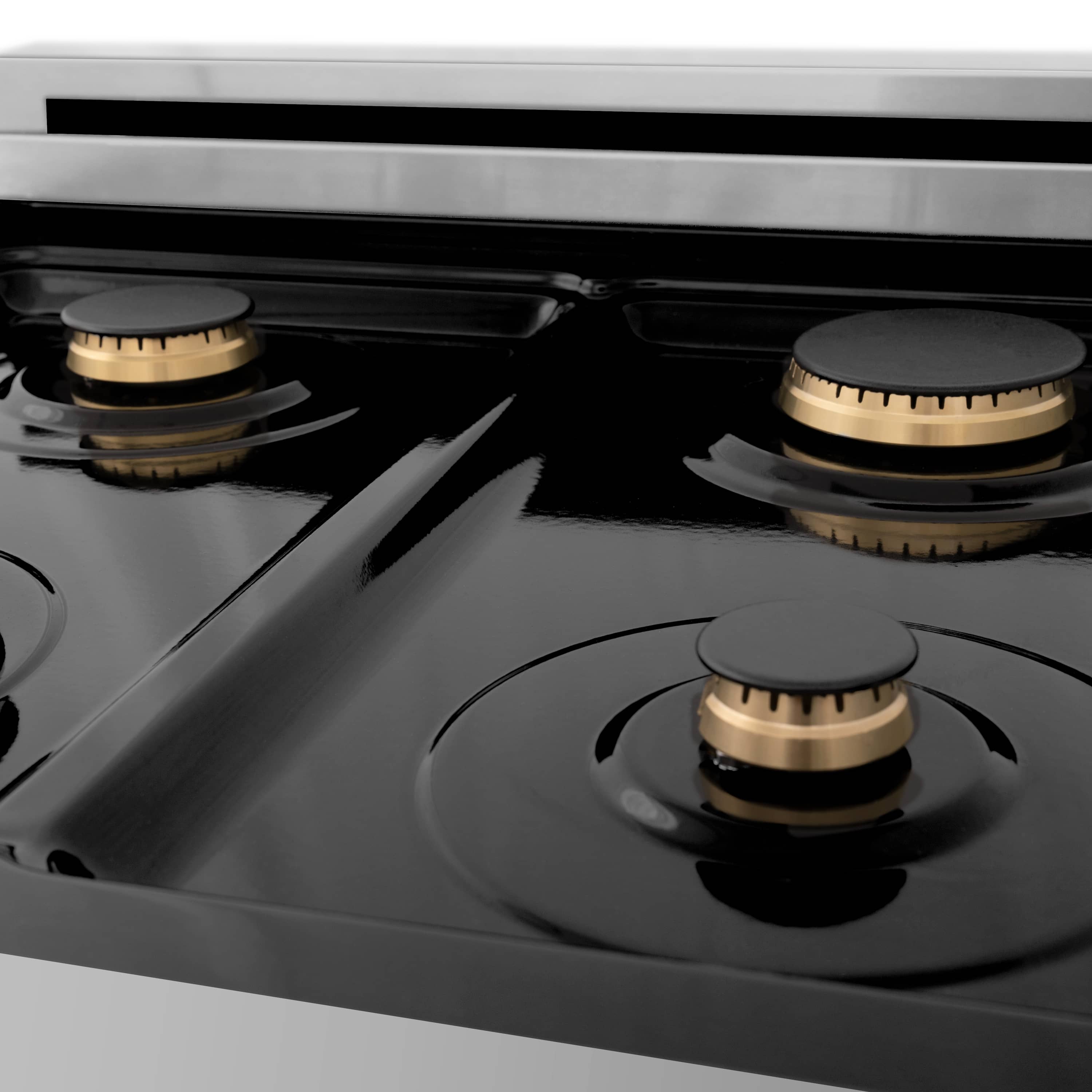 Stainless dual-fuel range cooktop with four black grates and brass burner caps