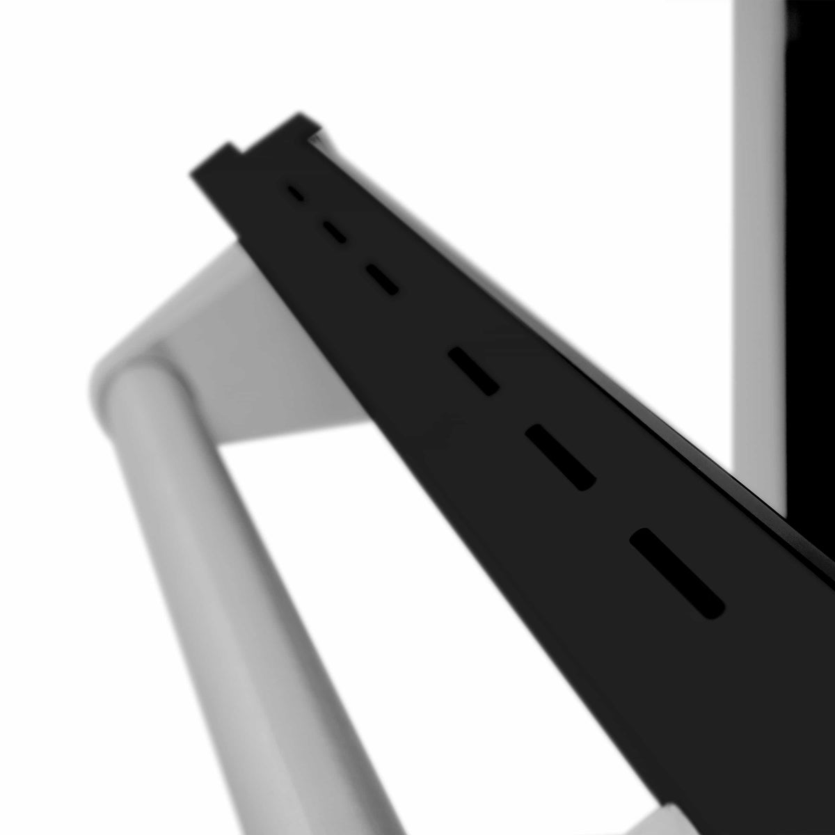 Black burner grate arm with slotted design on stainless range cooktop