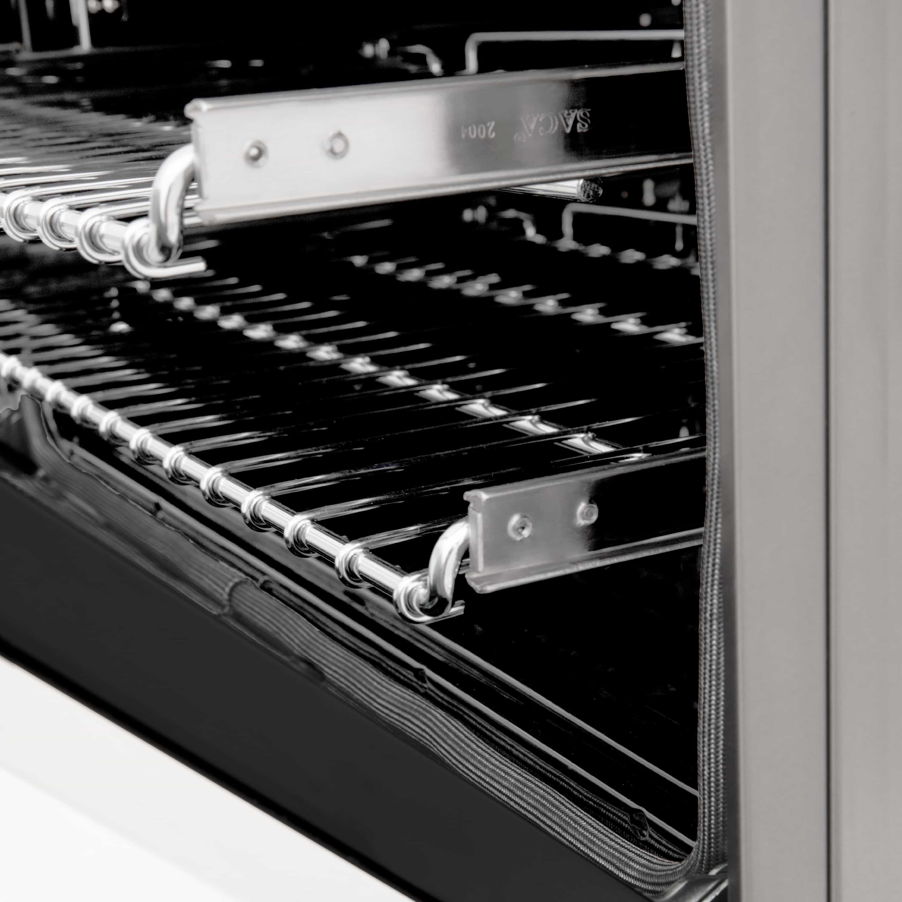 Electric oven interior with metal racks and heating elements inside the open door.