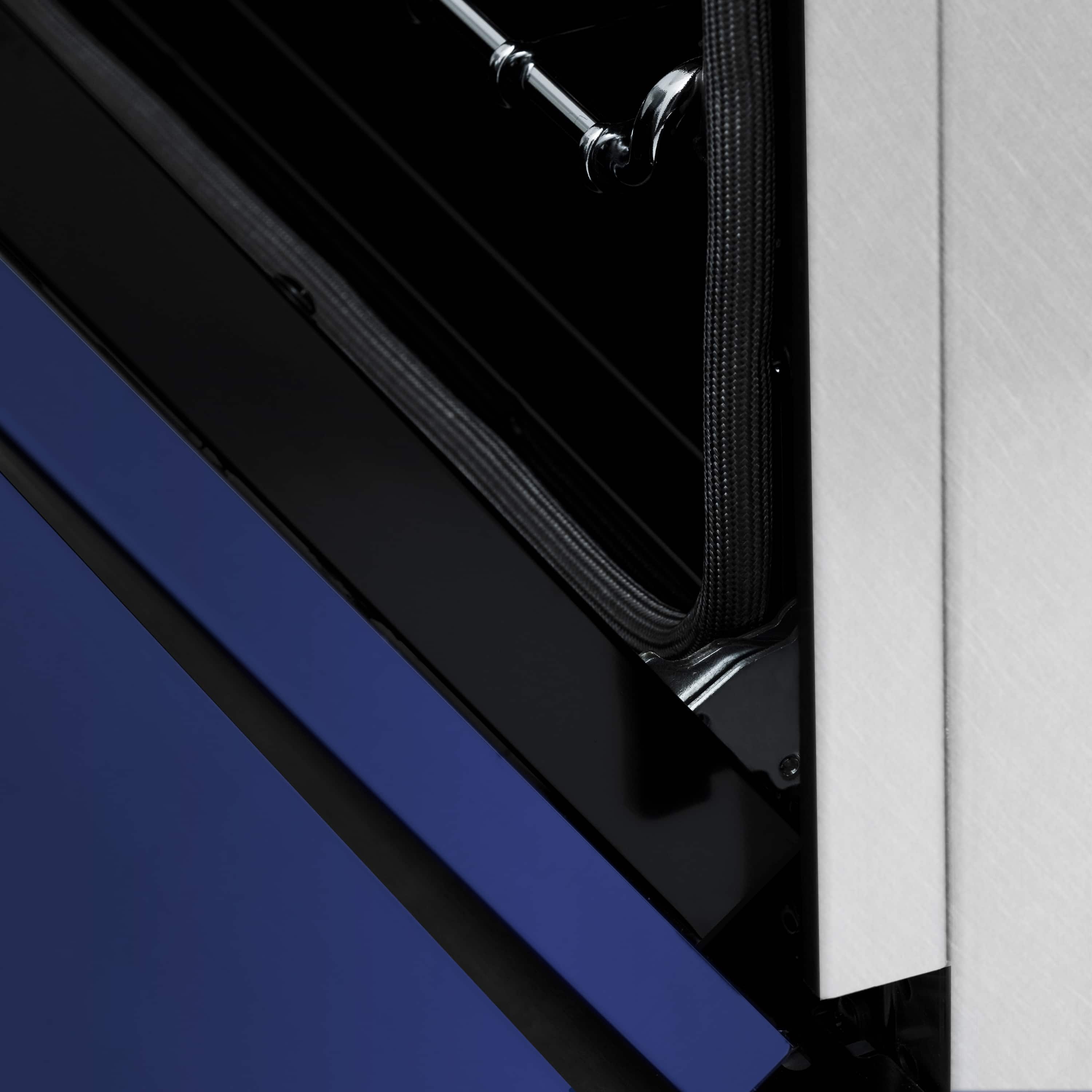 Dual fuel range side view with satin stainless trim and blue matte door panel