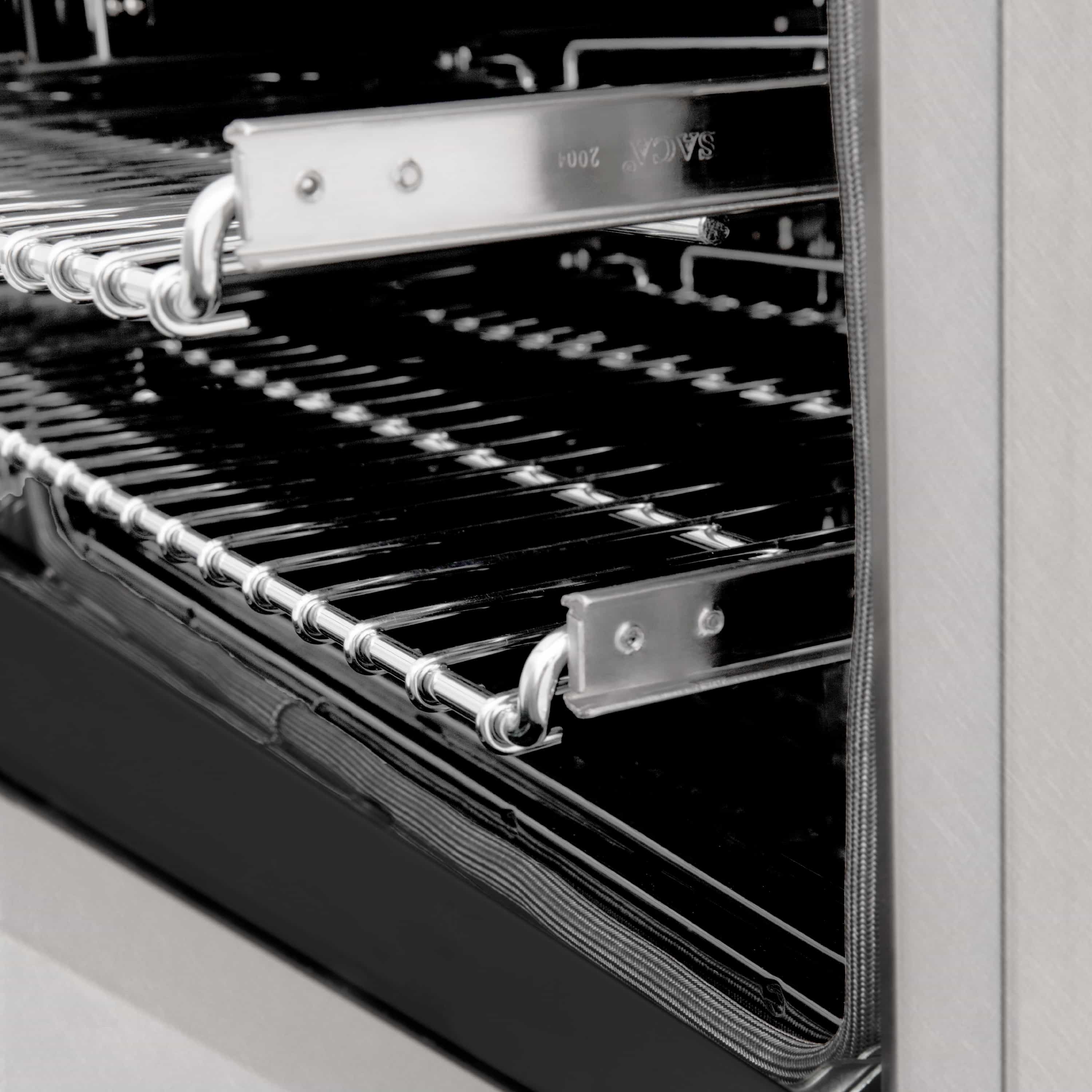 Oven door area with chrome rack rails and black mesh oven floor