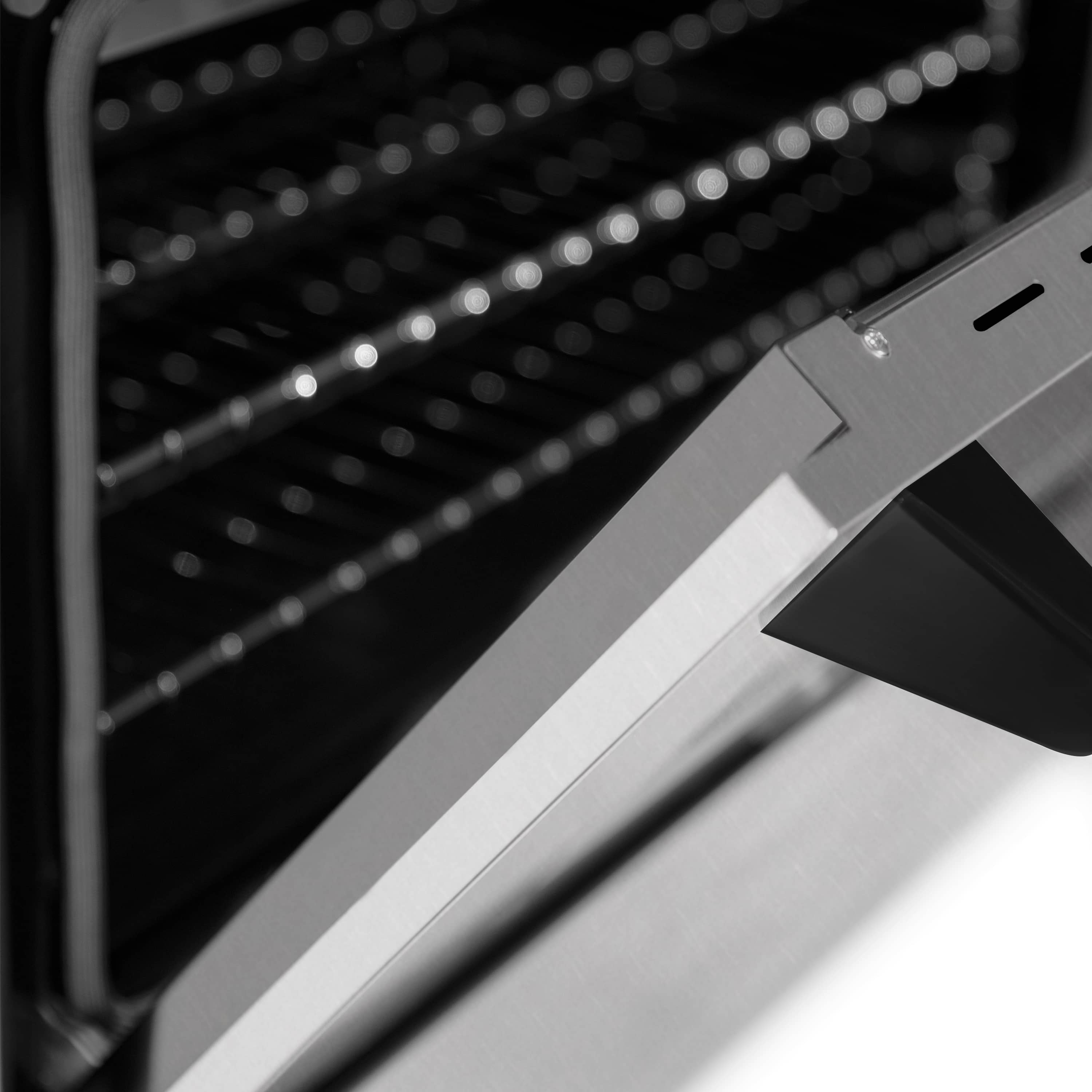 Stainless oven door handle with control panel edge on dual-fuel range