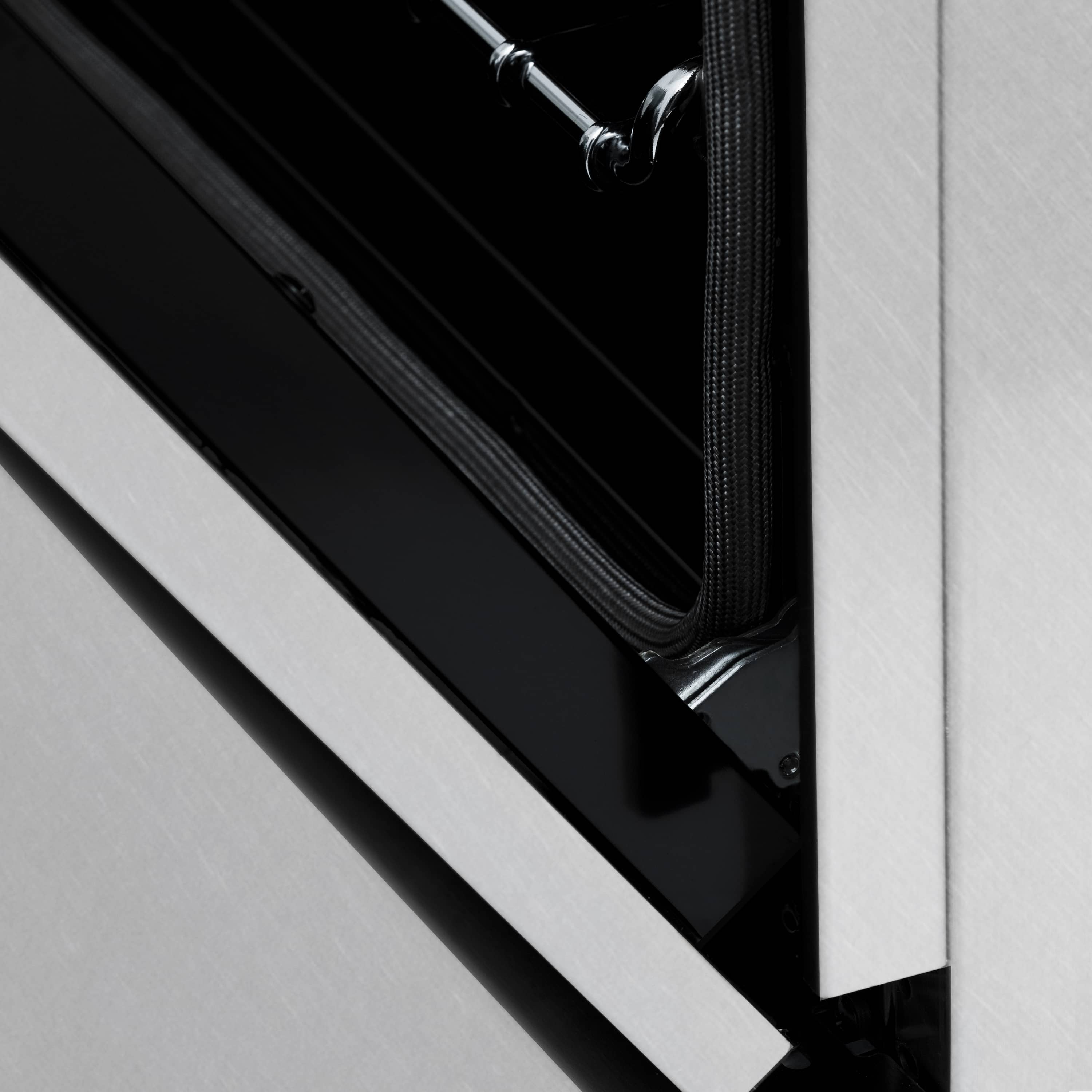 Dual fuel range open oven door with black trim and chrome hinge hardware