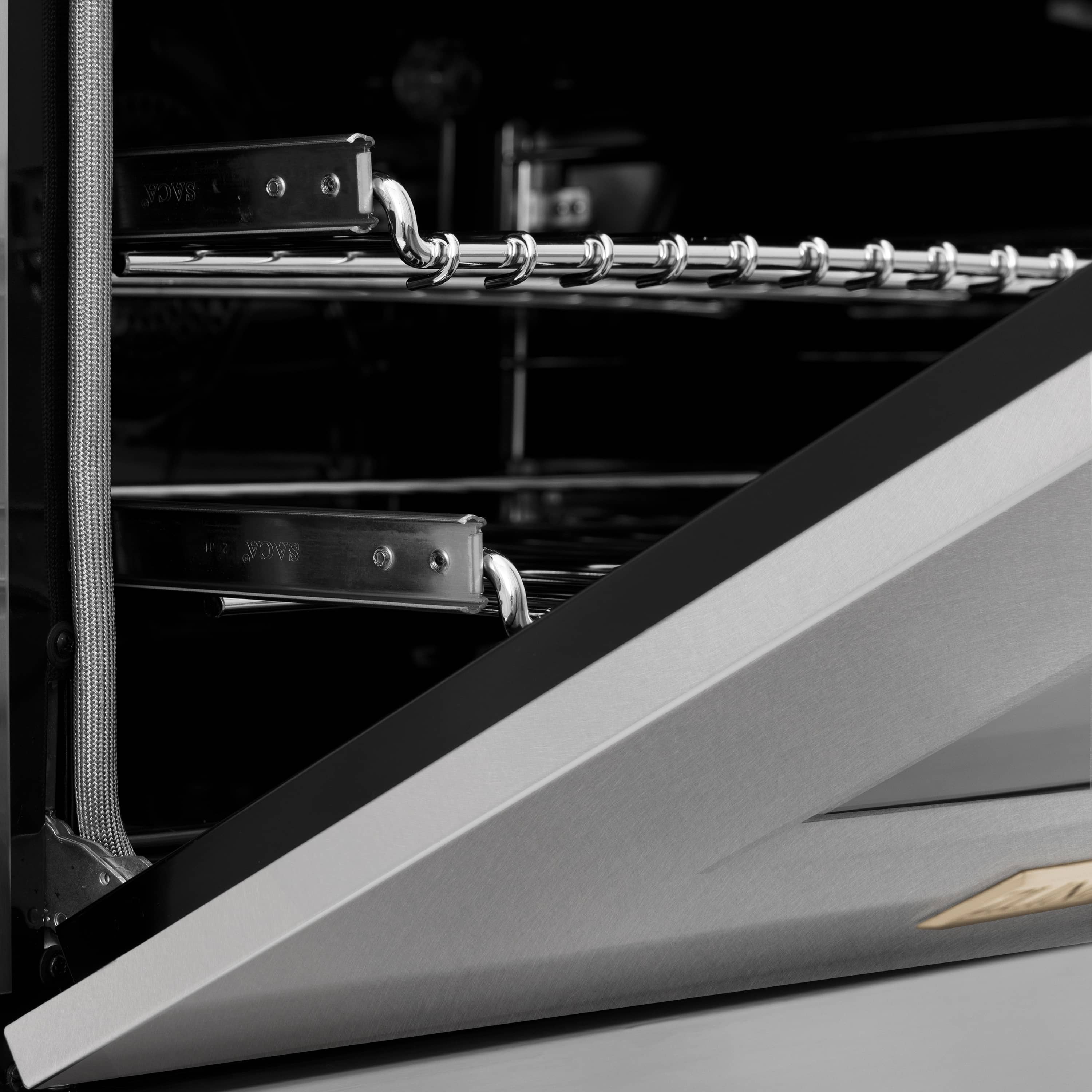 Electric oven interior with chrome rack supports and rack rails