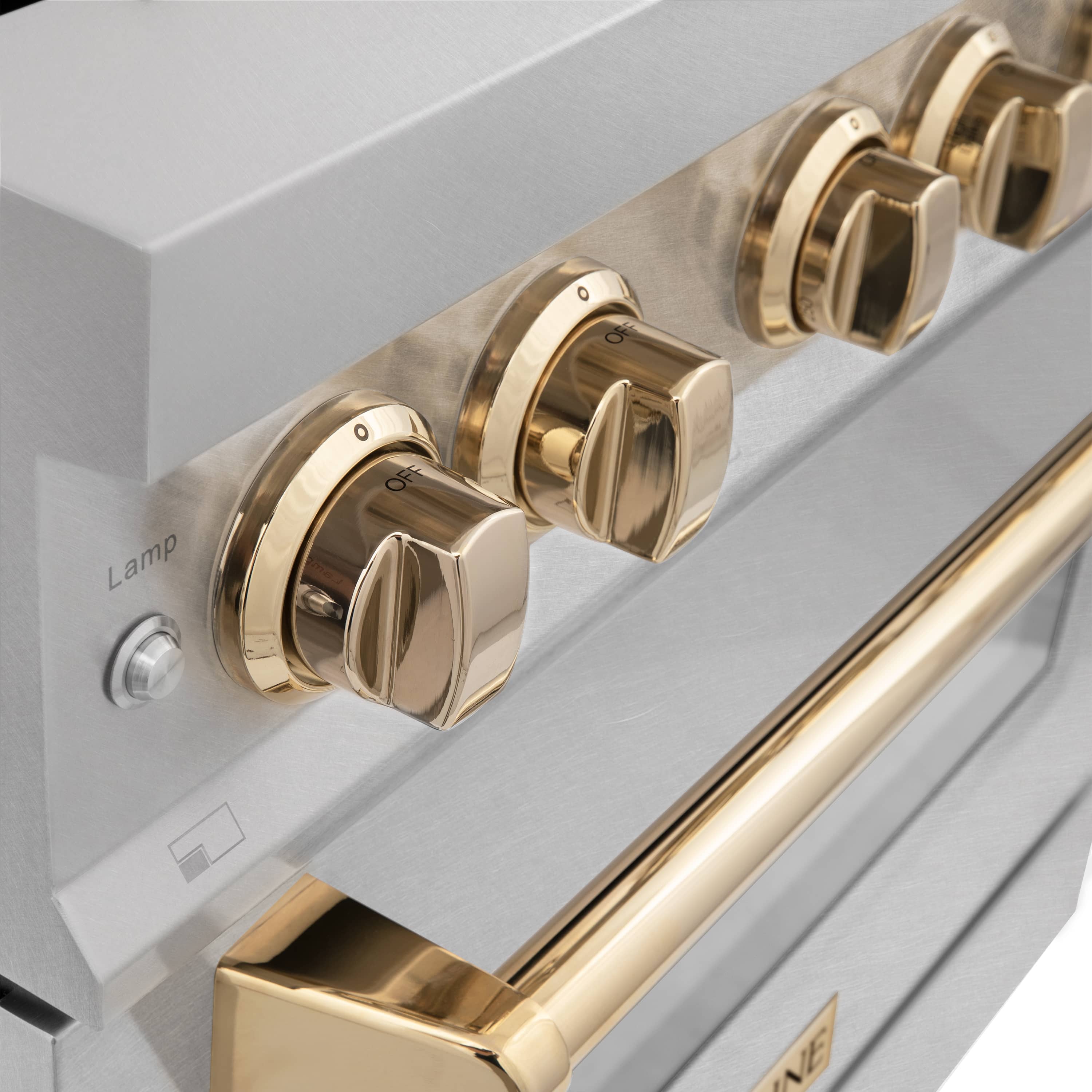 Satin stainless oven front with gold-finish control knobs and handle accents