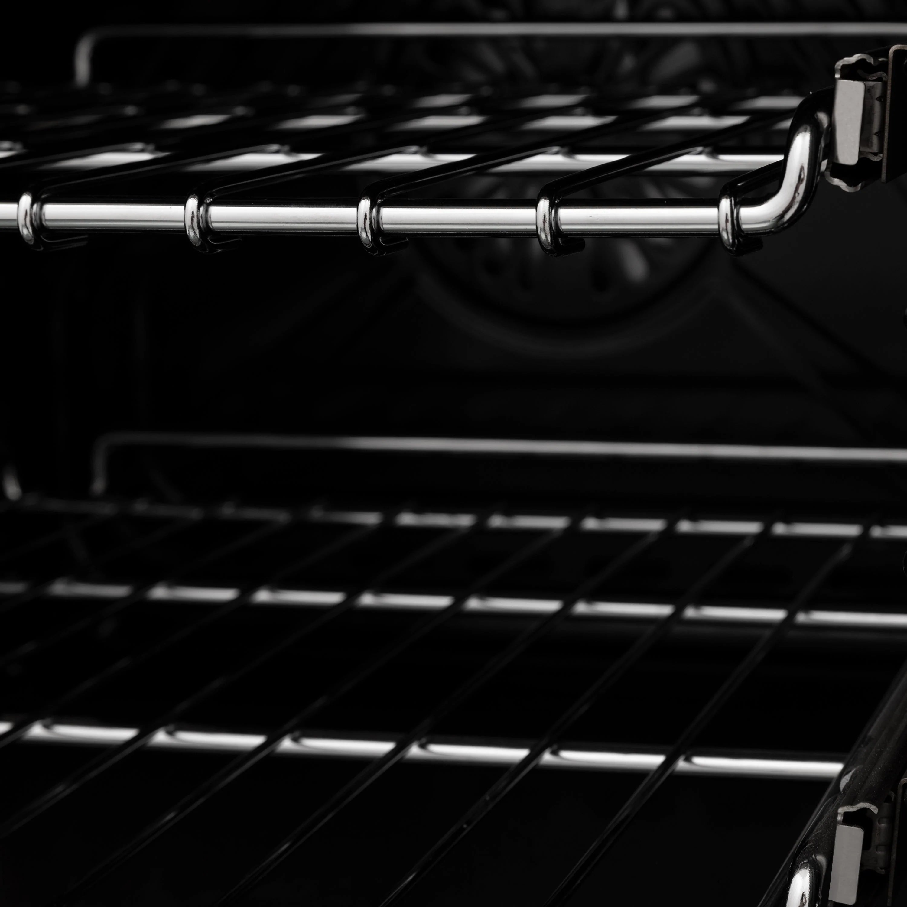 Dual fuel range oven racks and heating elements inside the open oven