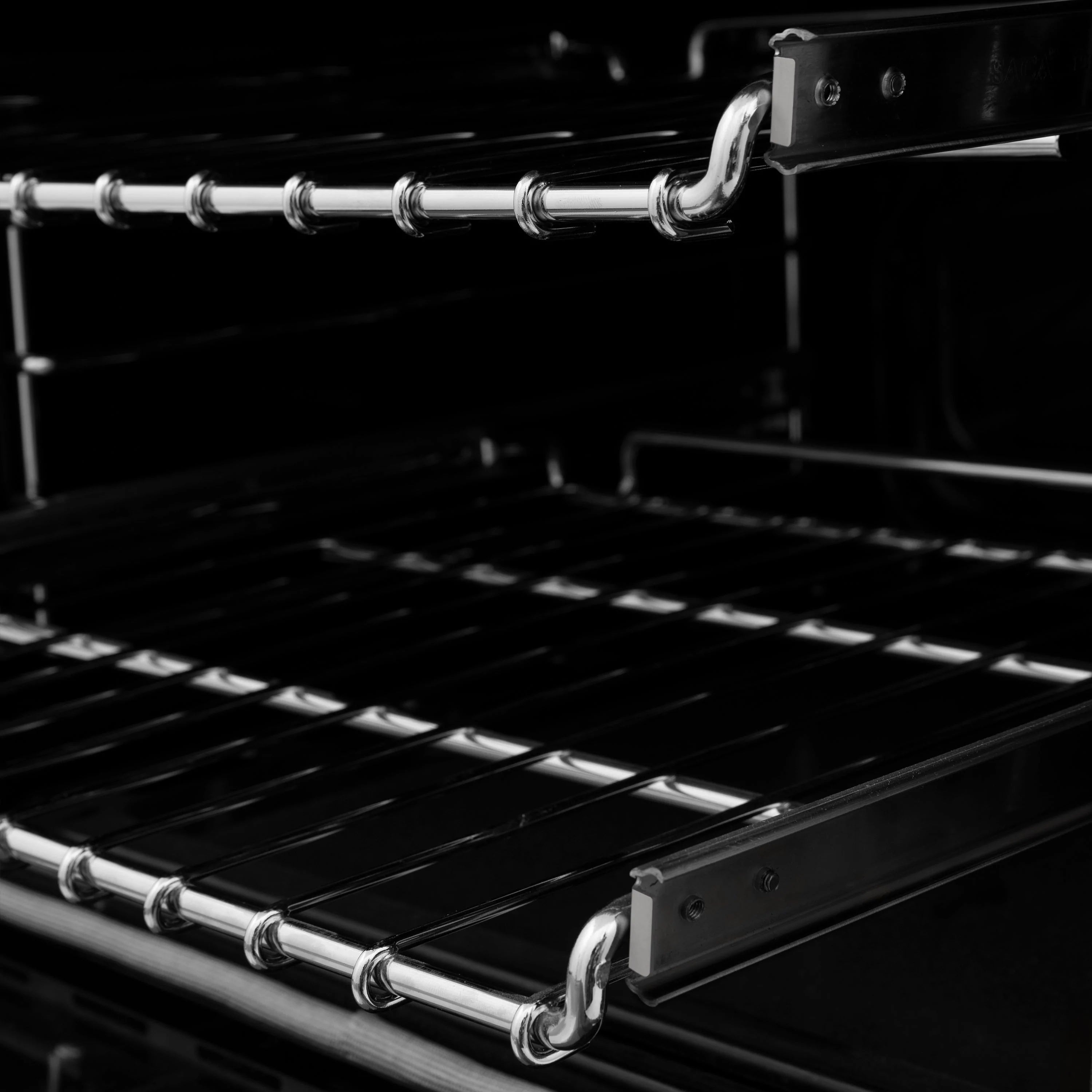 Dual fuel range oven interior with chrome racks and black bake area