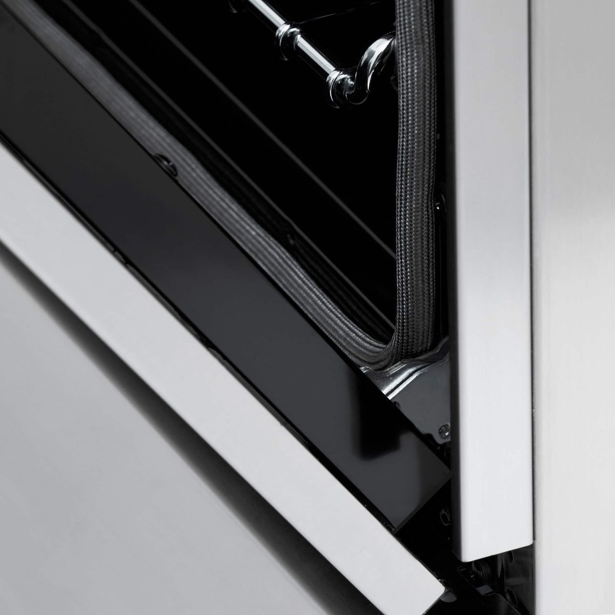 Dual fuel range oven door seal with black gasket and stainless frame