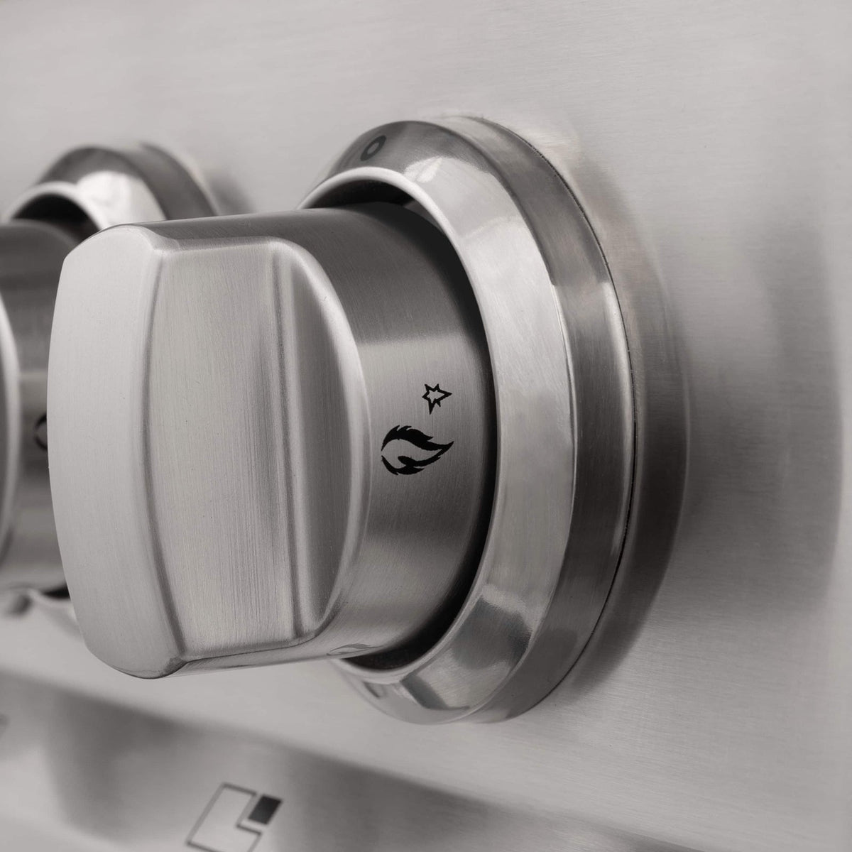 Stainless control knobs on ZLINE range front, dual fuel selector and indicator marks