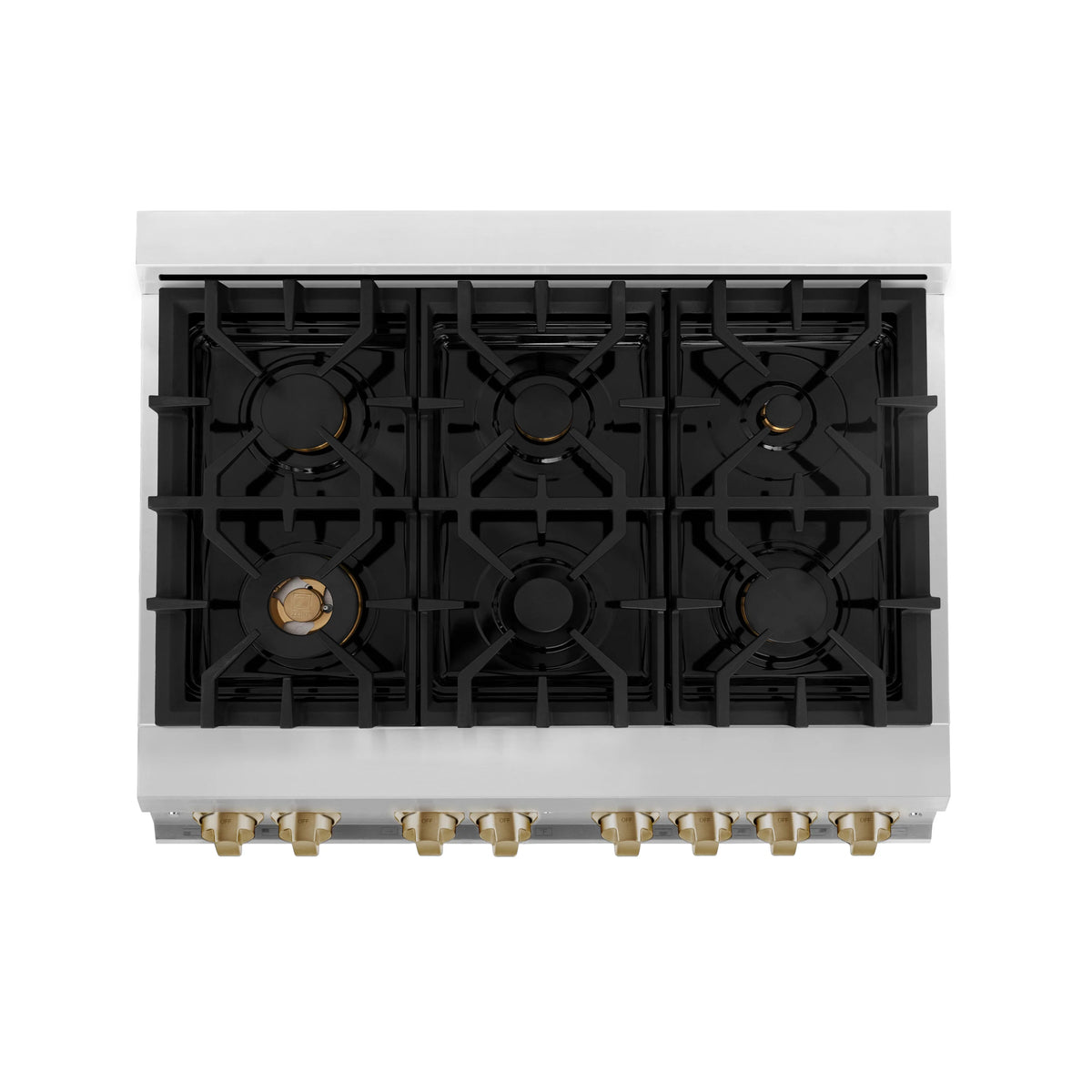 White dual fuel range cooktop showing black burner grates and gold burner caps from above