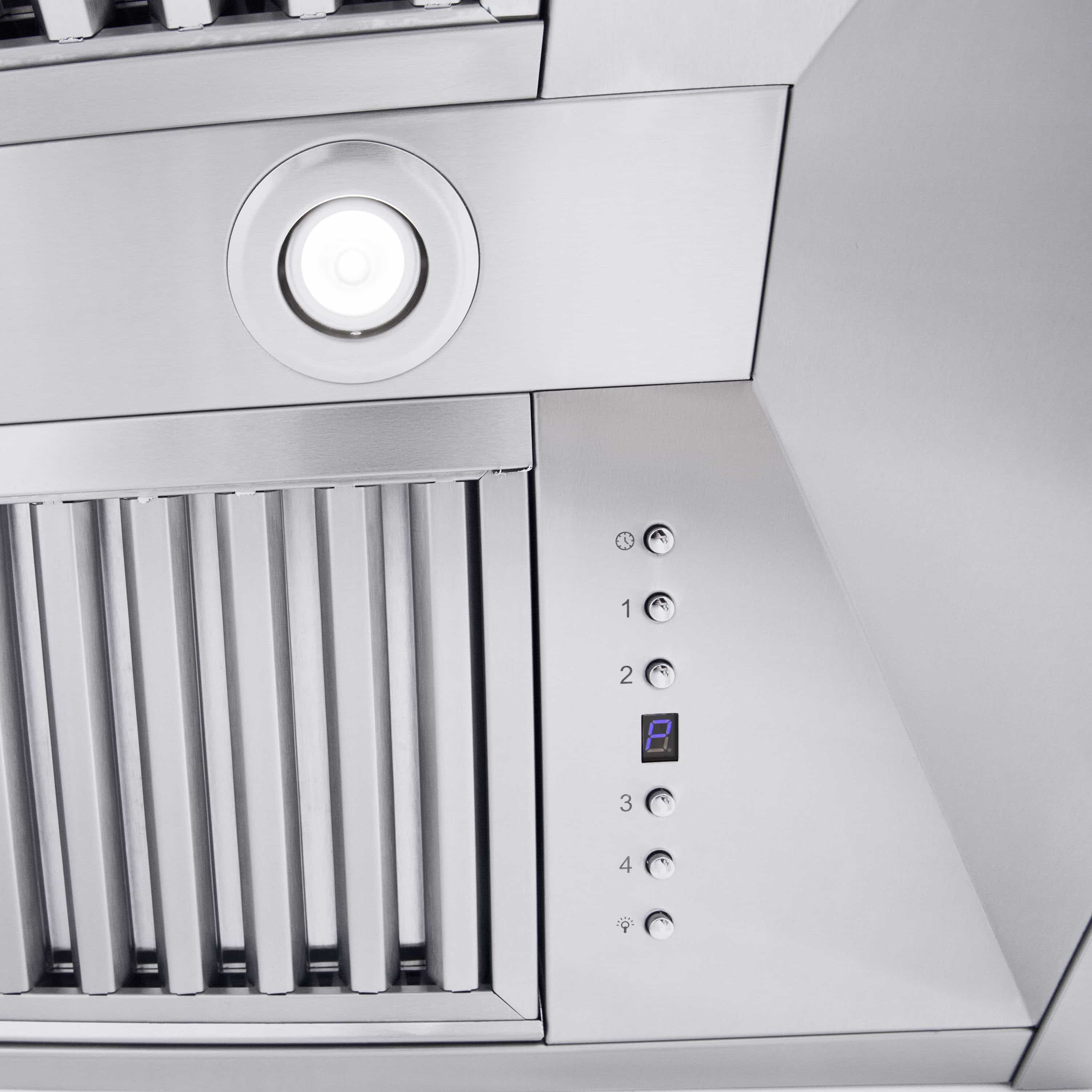 Stainless steel range hood with circular light and vertical vent louvers beside controls