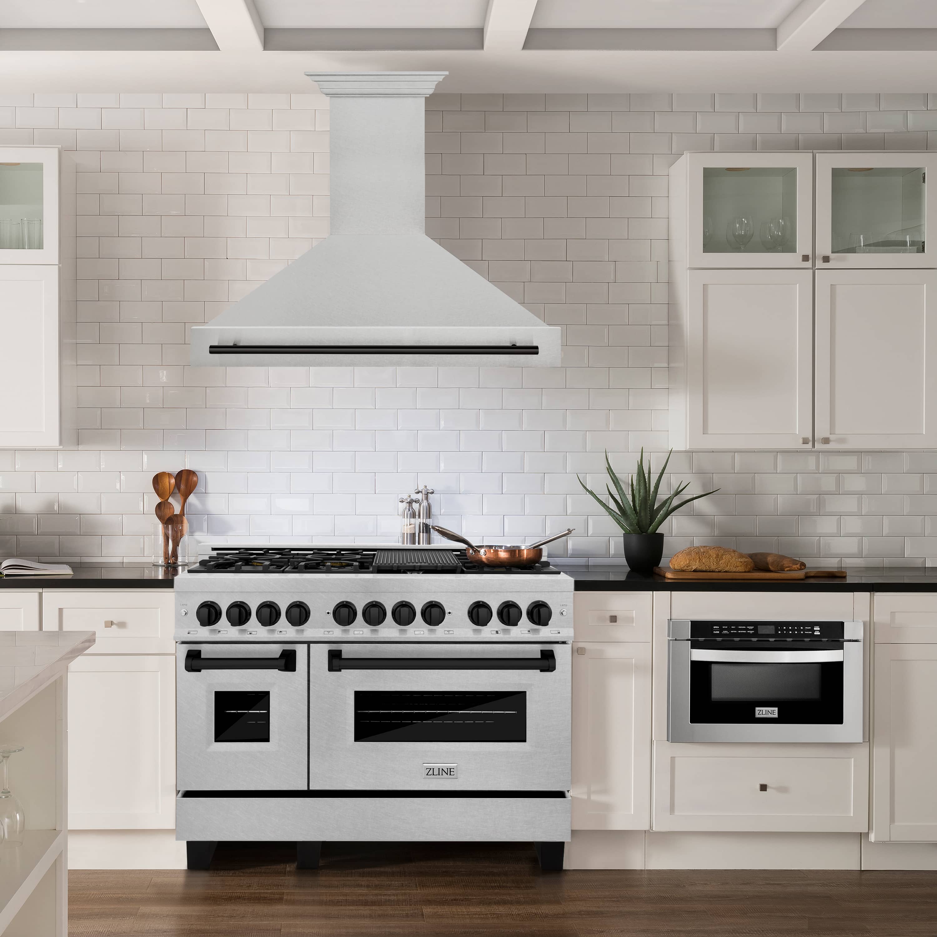 Wall mount range hood over stove: satin stainless steel with matte black handle, ducted vent