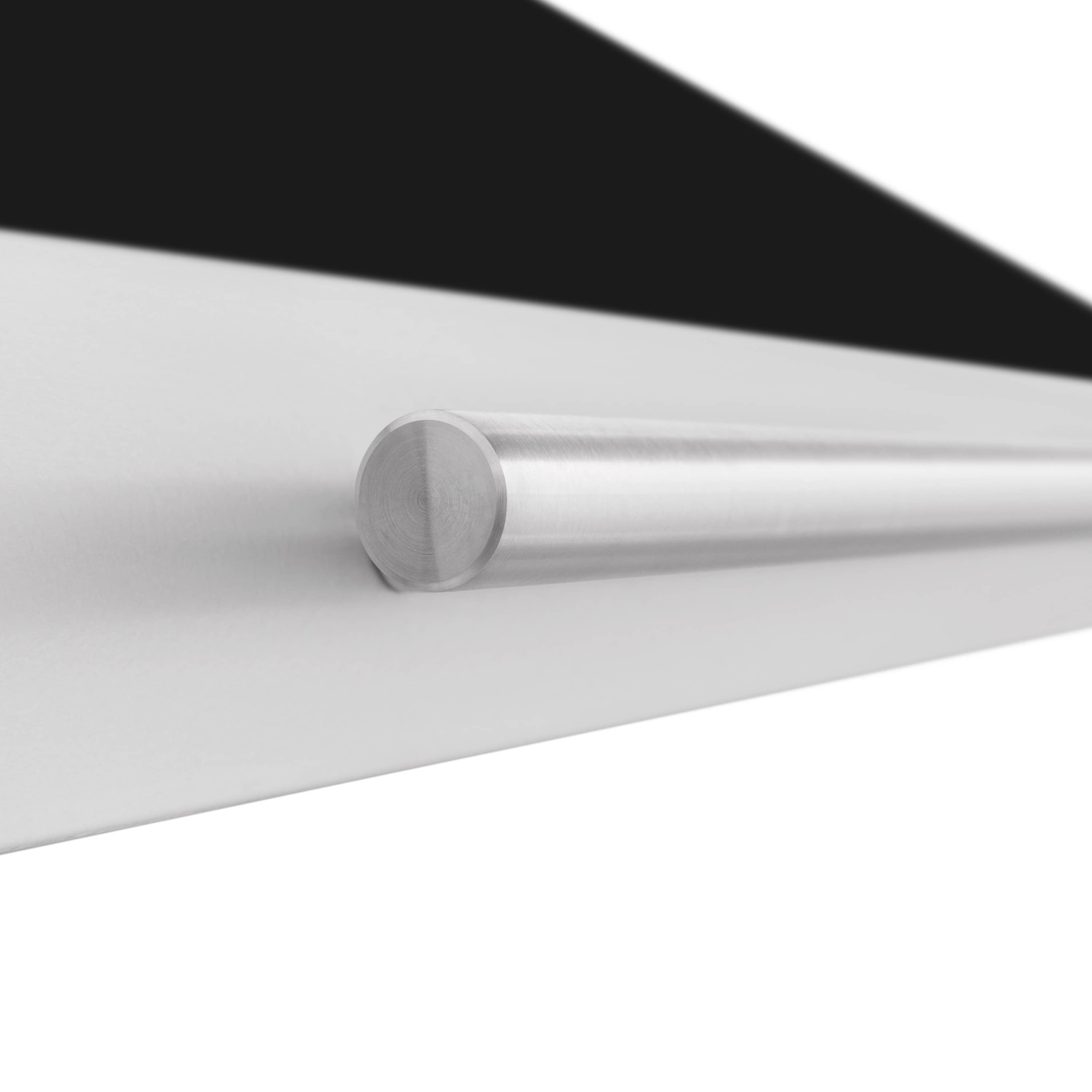 Range hood vent handle detail on white and black matte canopy