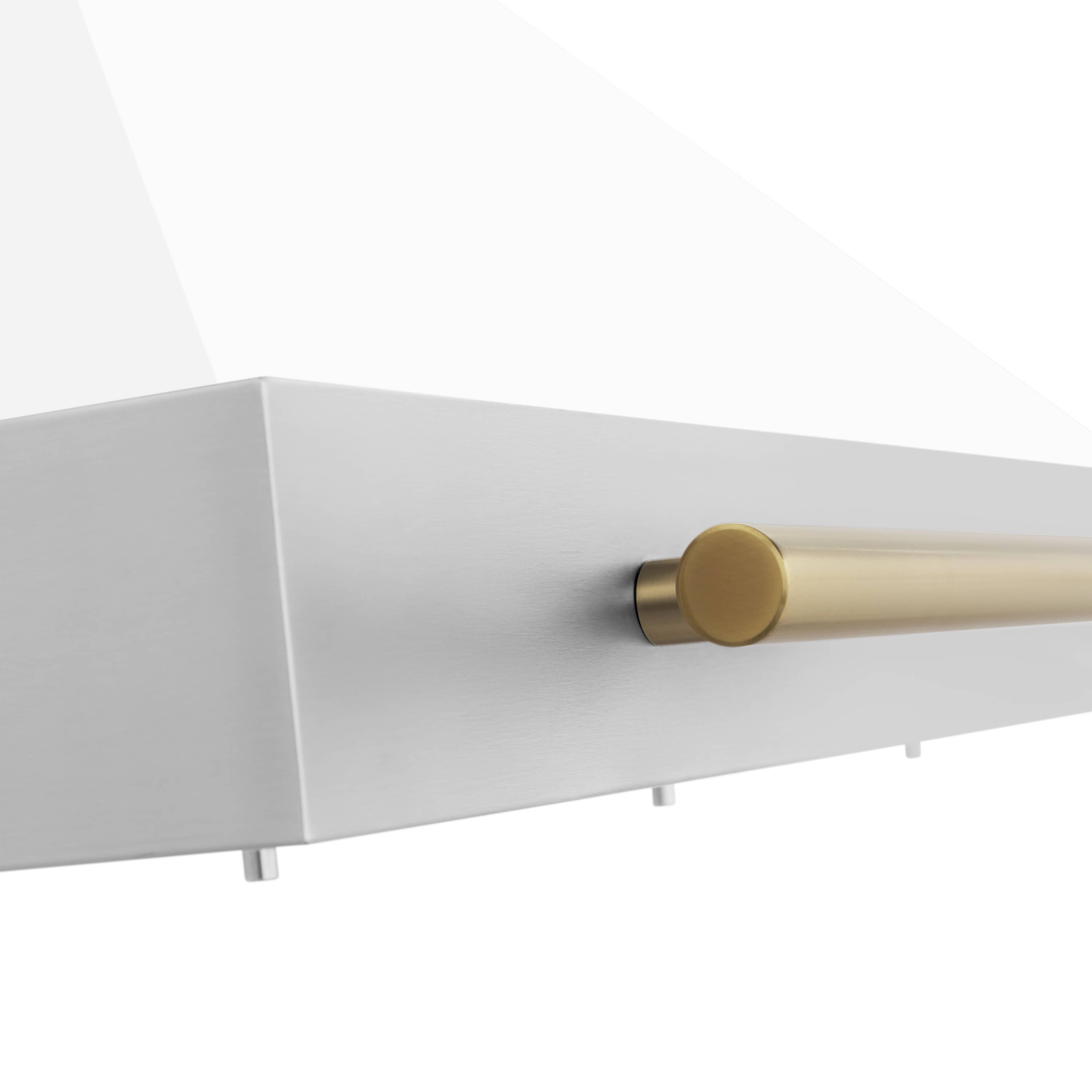 Wall-mounted range hood side detail with gold end cap on the horizontal vent bar
