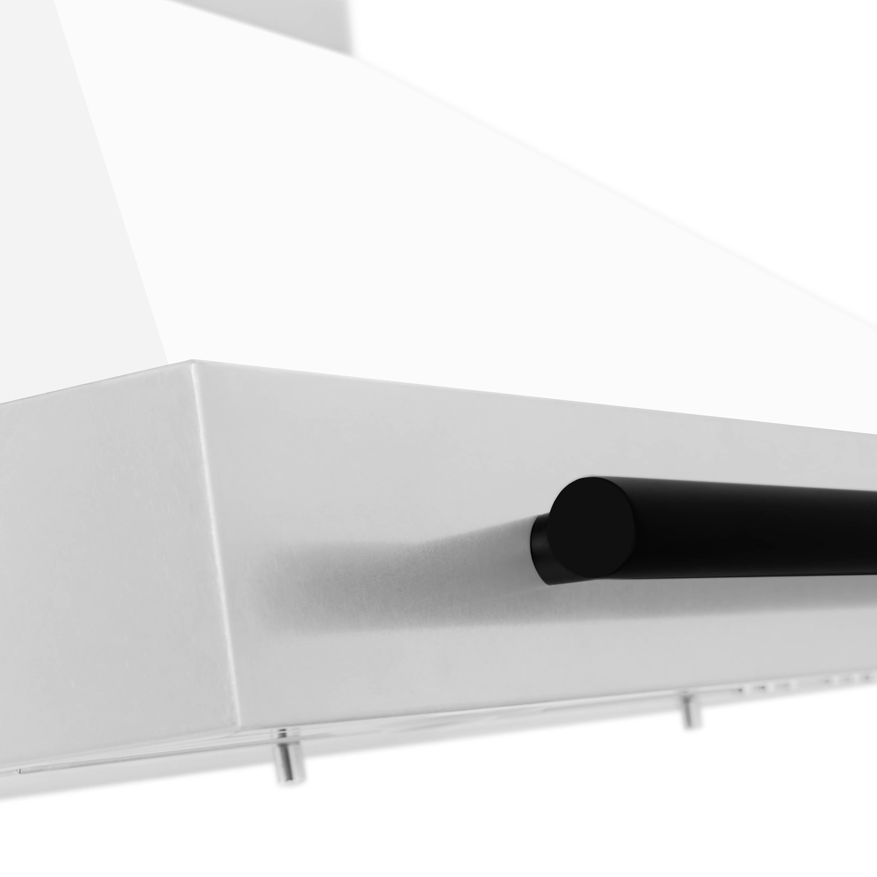 Wall-mounted range hood black round duct outlet under white canopy