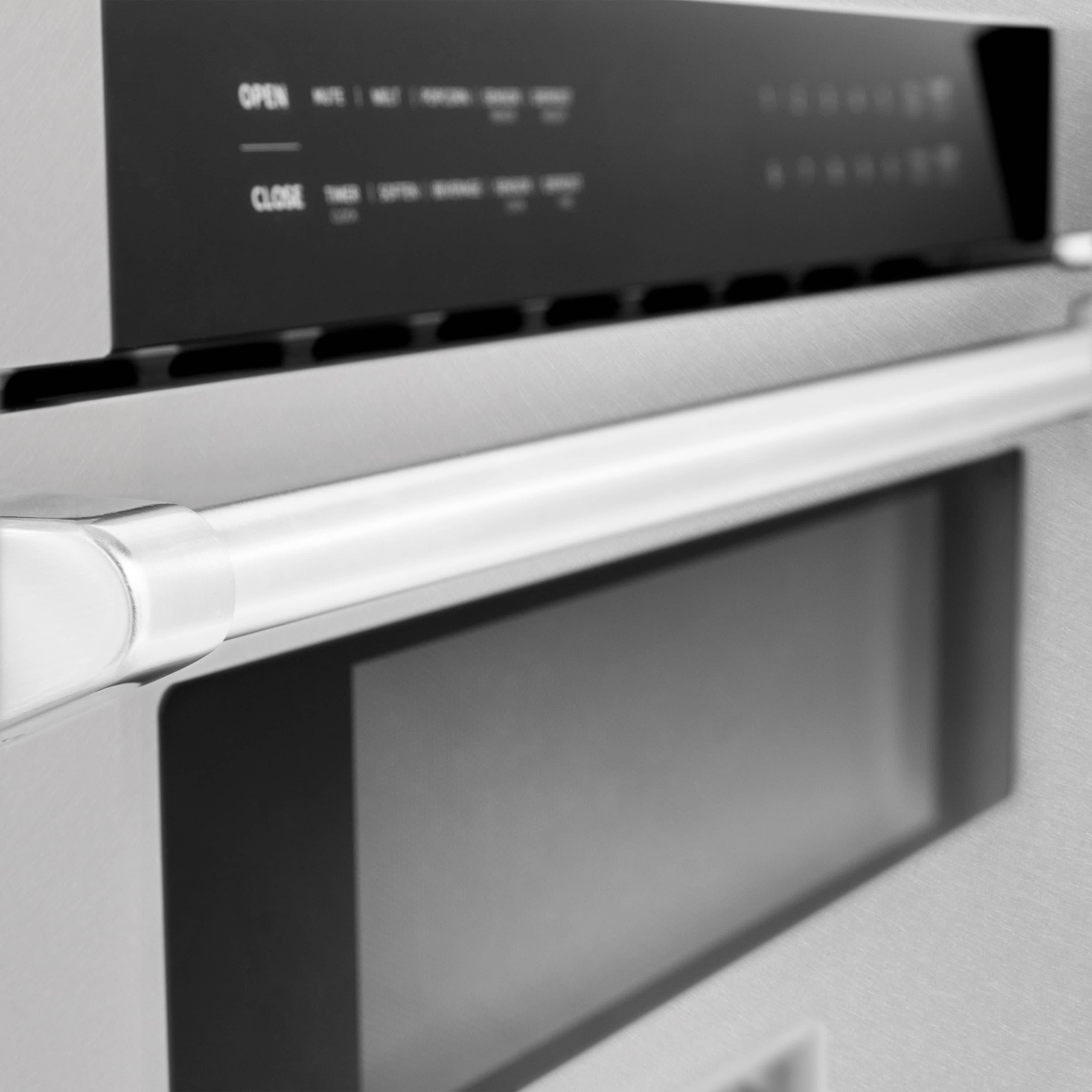 Microwave drawer close-up: satin stainless handle and black control panel
